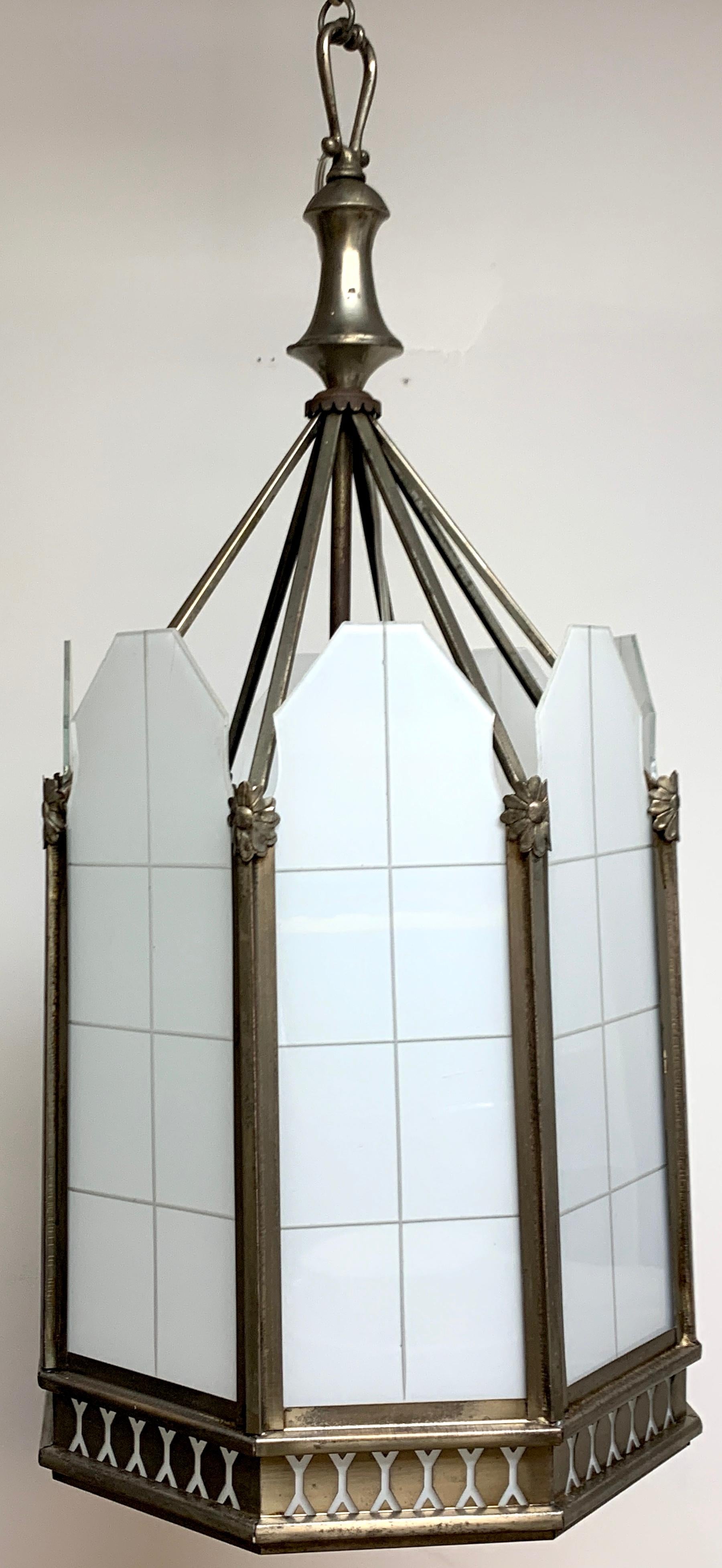 Art Deco octagon lantern from The El Cid Theatre, Los Angles, detailed deco Gothic silvered metal and engraved frosted glass 8-panel pendant. A splendid example of Historical Hollywood Memorabilia.
Lantern measures 28