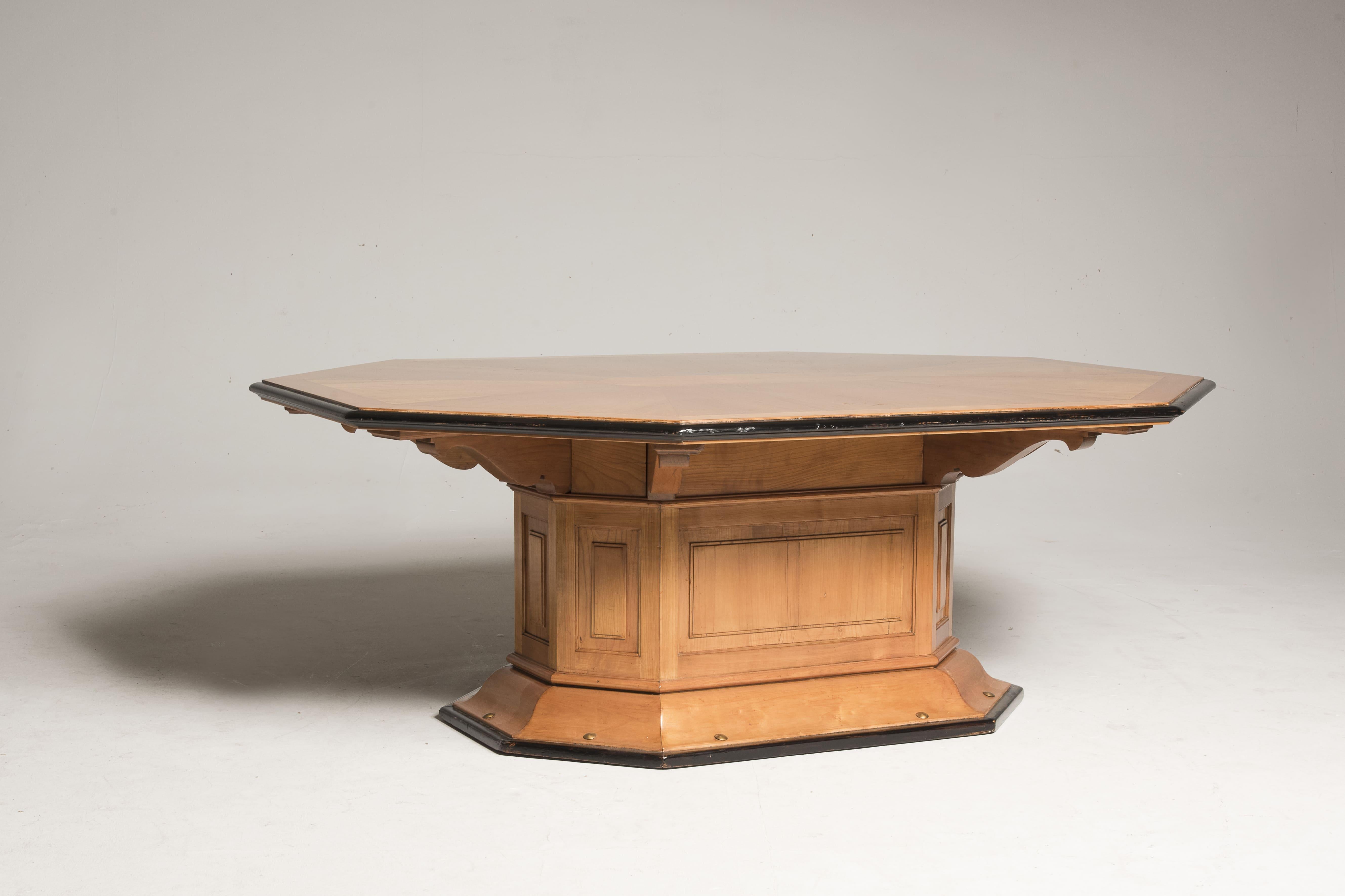 Art Deco Table form Italy from 1930s period.
The table is made in cherry wood, features black borders and brass studs on the foot.
It is particular for its octagoal section and its big central leg making this a sculptural and unique piece.
The