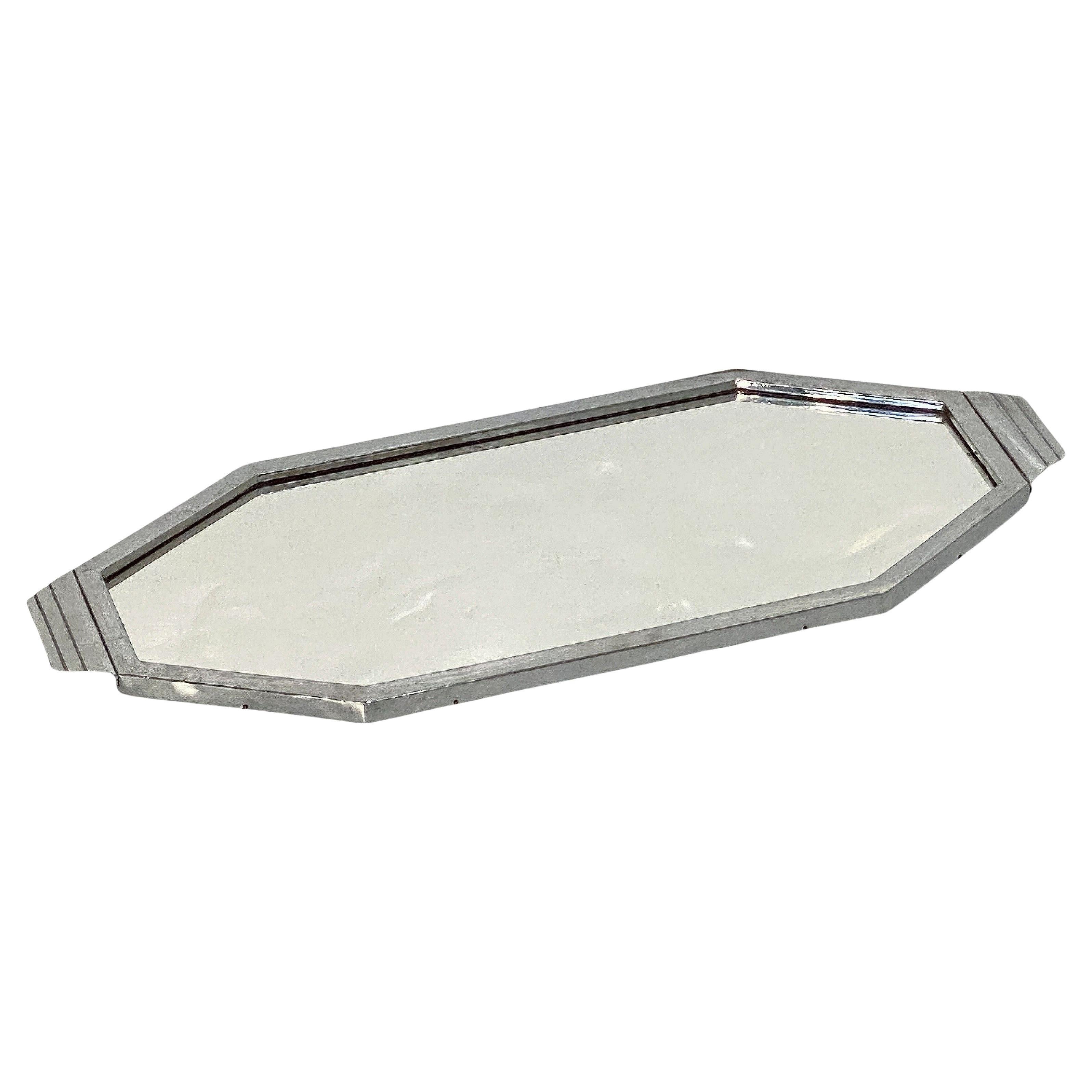 A fine English rectangular mirrored serving tray of chromed metal from the Art Deco Era featuring an eight-sided geometric design. 

Perfect for a cocktail spirits bar or martini set.