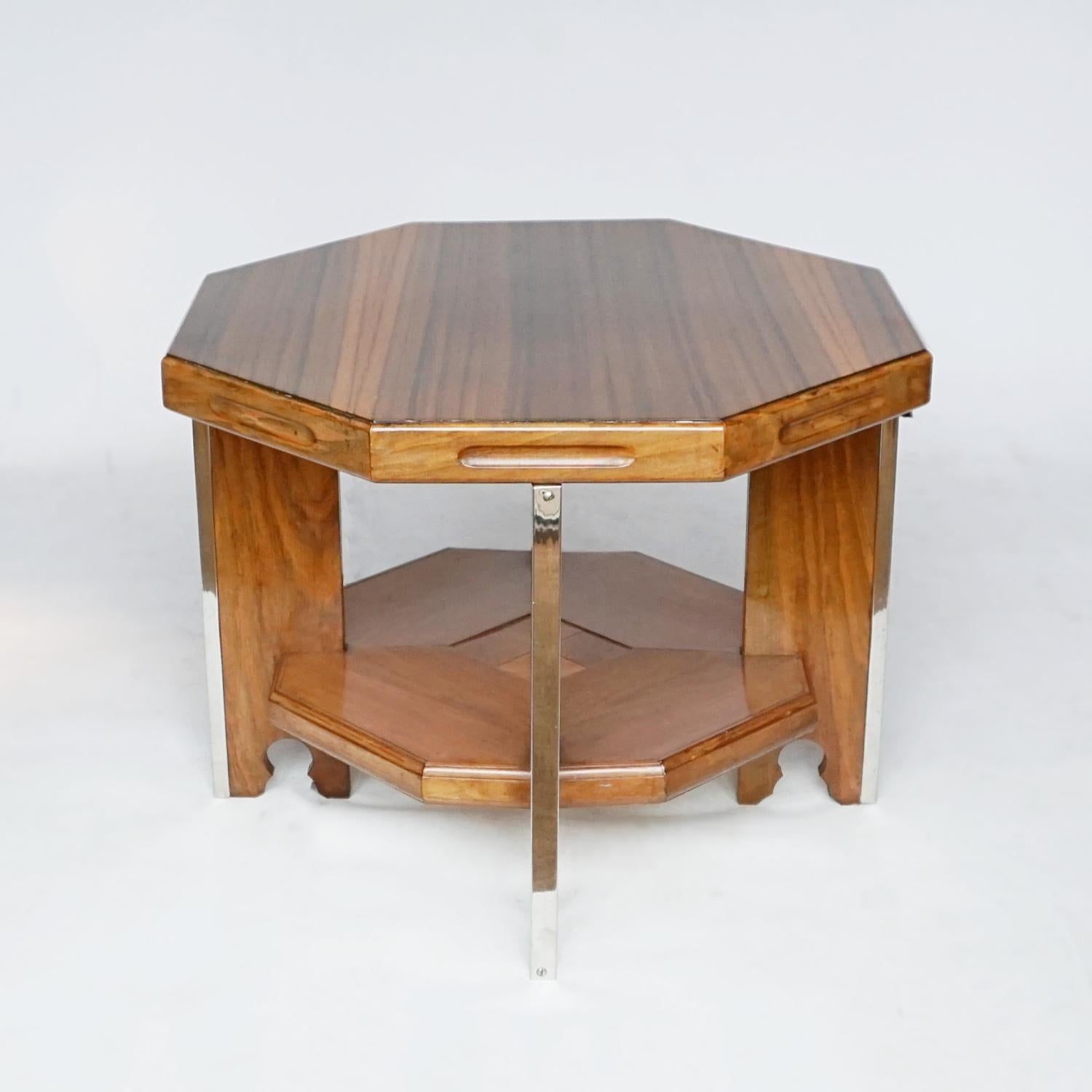 Small proportioned Art Deco octagonal coffee table. Figured walnut and solid walnut. Chromed metal banding to table legs. 

Dimensions: H 48cm W 62m D 62cm 

Origin: English

Date: Circa 1935

Item Number: 312211

All of our furniture is