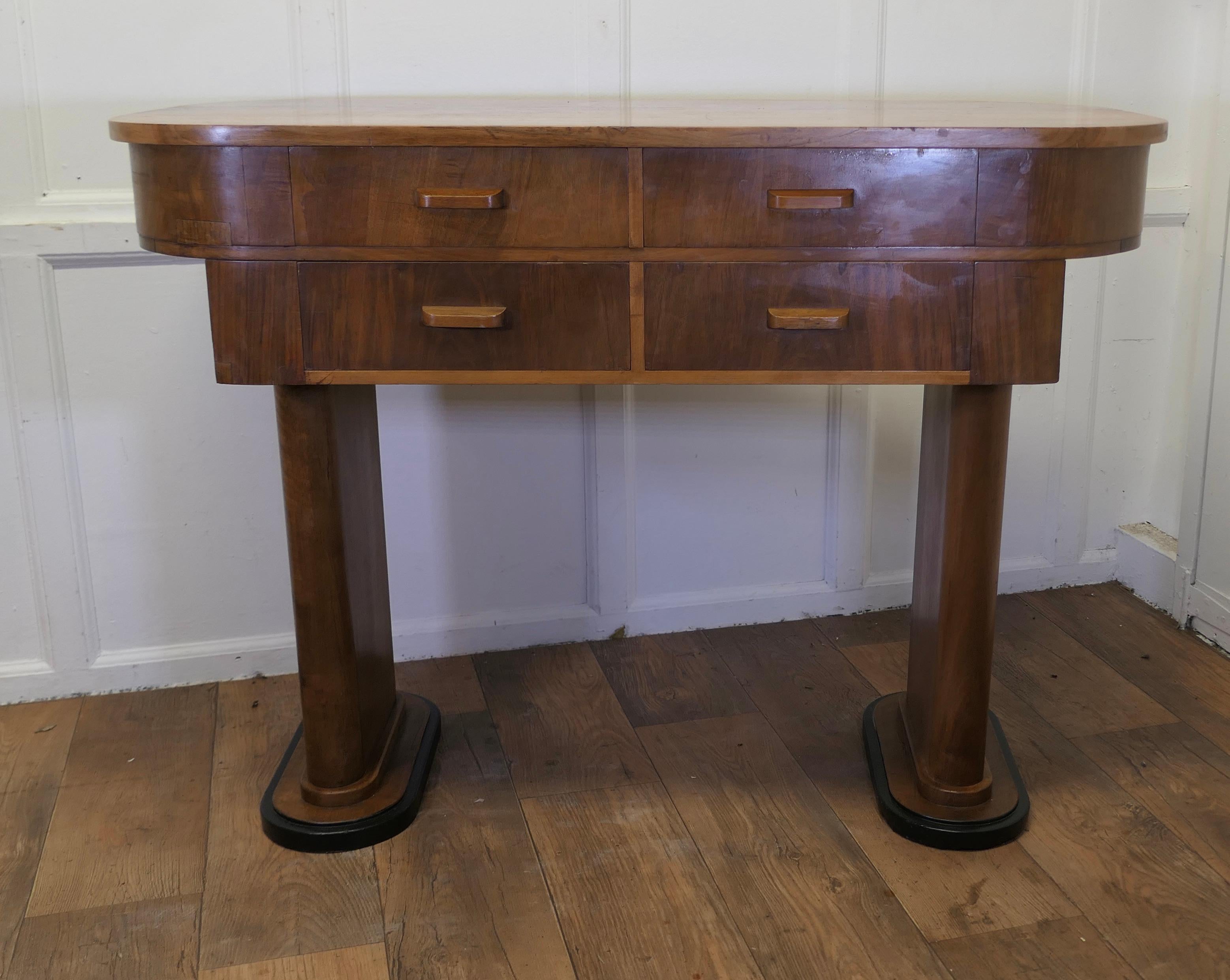Art Deco Odeon Style Console, Side Table or Greeter in Walnut

This is an elegant and stylish piece from the 1920s, the table has 4 deep drawers and it looks superb from all sides, so it would work well as a greeter 
The Side Table is in good