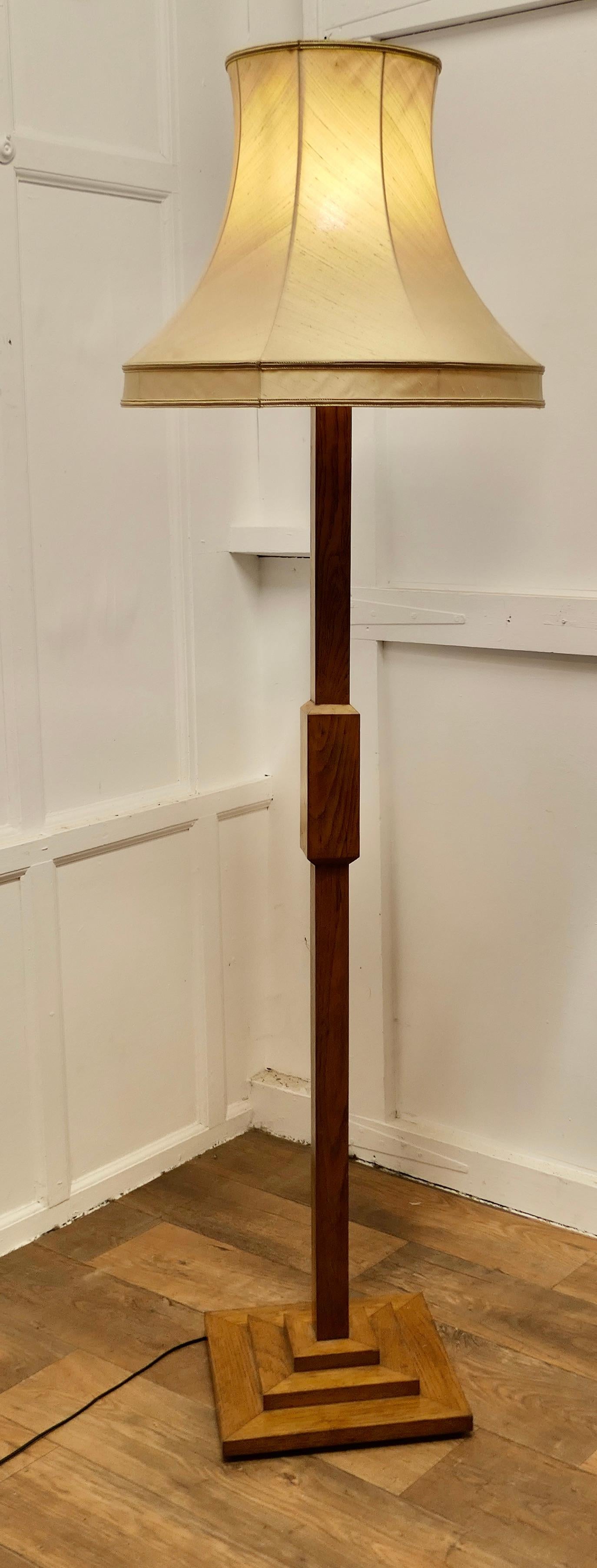 Art Deco Odeon Style Golden Oak Standard or Floor Lamp 

This is a very stylish piece, the stepped oak base supports a shaped  central column
The lamp is in good condition, working and is shown with its original “Vogue” lampshade, this has a tear on