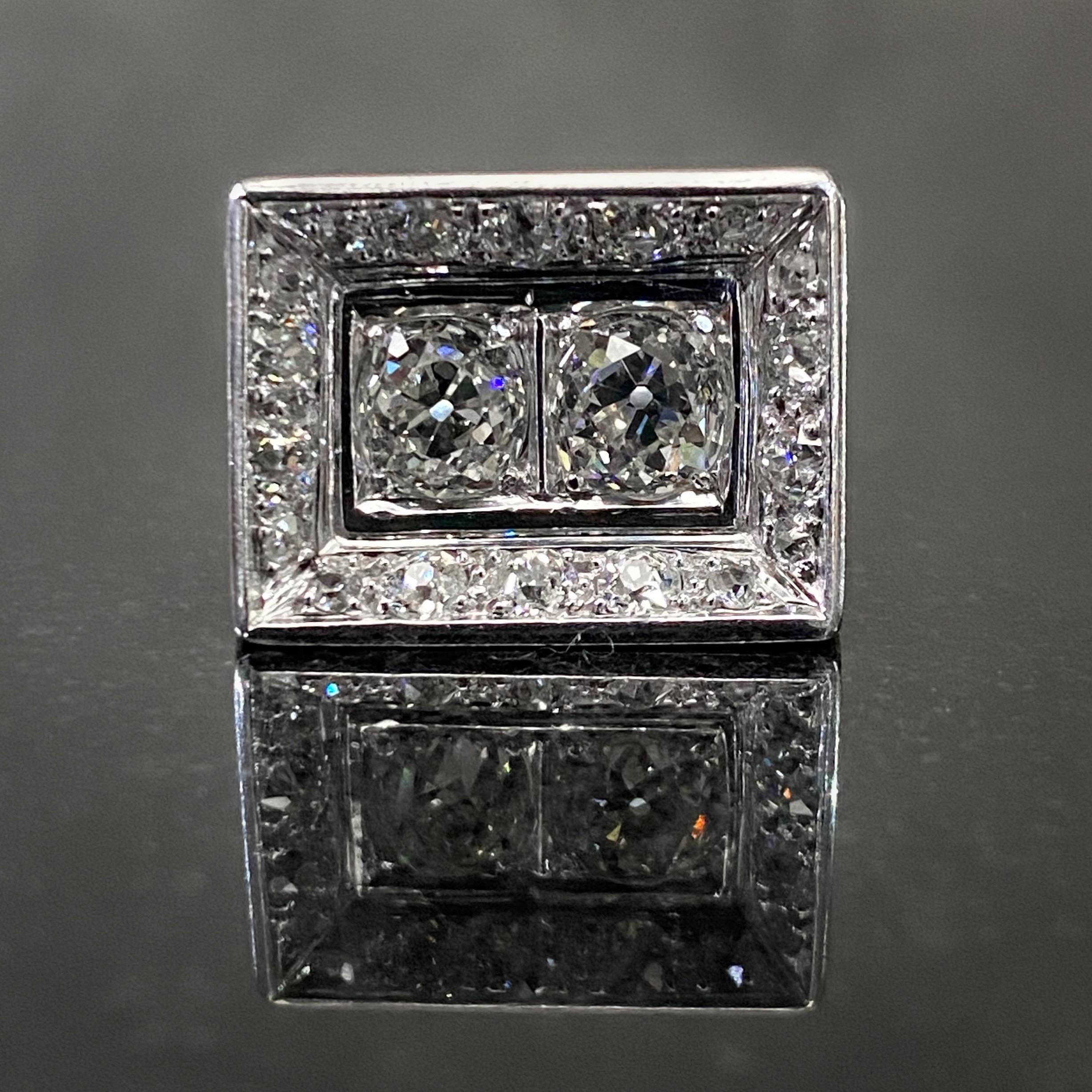 Art Deco Odeonesque Old Mine cut diamond geometric ring in 18 karat white gold, signed, Portugal, 1940s. Designed as a three-dimensional rectangular plaque that resembles a picture in a frame, this beautiful geometric ring features two Old Mine-cut