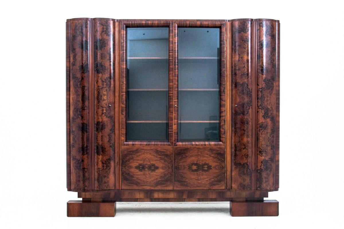 Art Deco office from the first half of the 20th century. Furniture in very good condition, after professional renovation. Made of walnut wood. 

Dimensions:

Library height 183 cm, width 199 cm, depth 47 cm

Desk height 78 cm, width 155 cm,