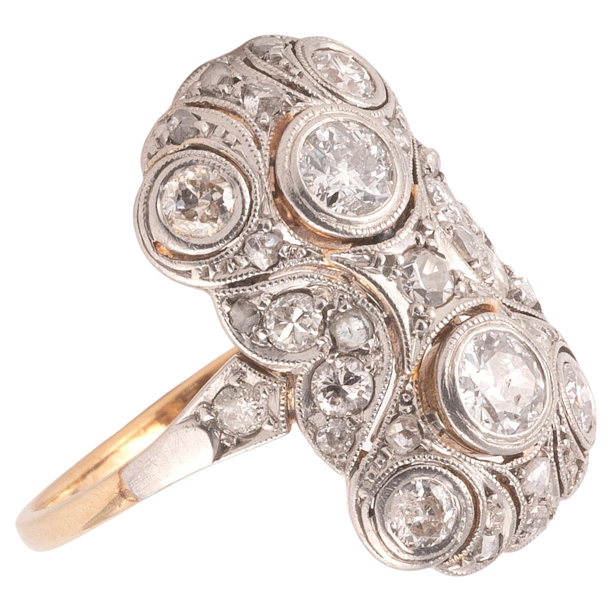 18 kt gold Art Deco diamond-ring , approx. 1910, ring head pierced and significant for the period in platinum, 32 oldcut diamonds and diamond roses total approx. 1.20 ct 
Size 6 3/4
Weight: approx. 3.9 g

