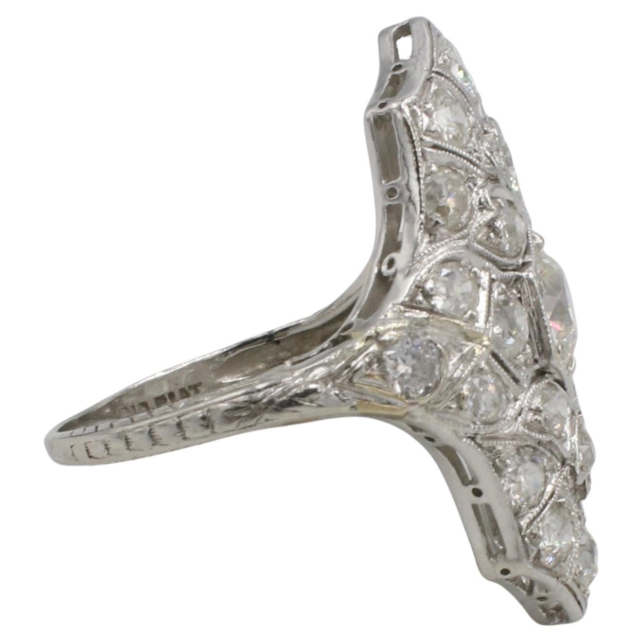 Art Deco Old European Cut 1.00 Carat Natural Diamond Navette Cluster Ring 

Metal: Platinum
Weight: 3.95 grams
Diamonds: Approx. 1.00 CTW old European cut H-I VS-SI natural diamonds. Center diamond is approx. 0.40 carats
Top: 24 x 18mm
Size: 5 (US)
