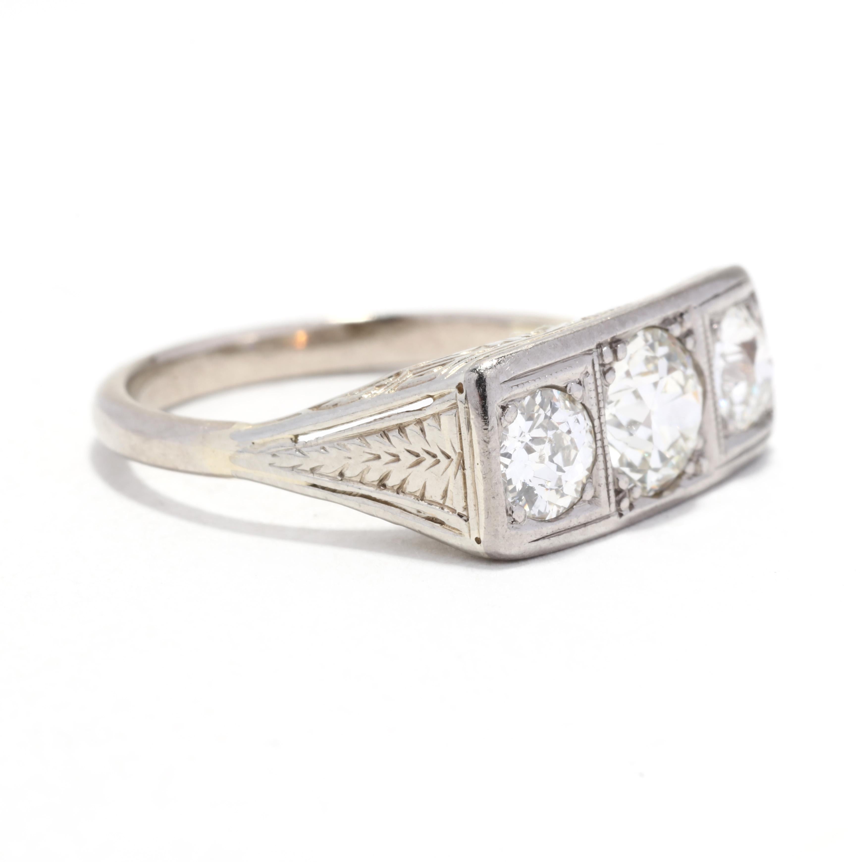 An Art Deco 14 karat white gold old European cut diamond three stone engagement ring. This antique engagement features a rectangular, horizontal design with a central old European cut diamond weighing approximately .75 carat with an old European cut