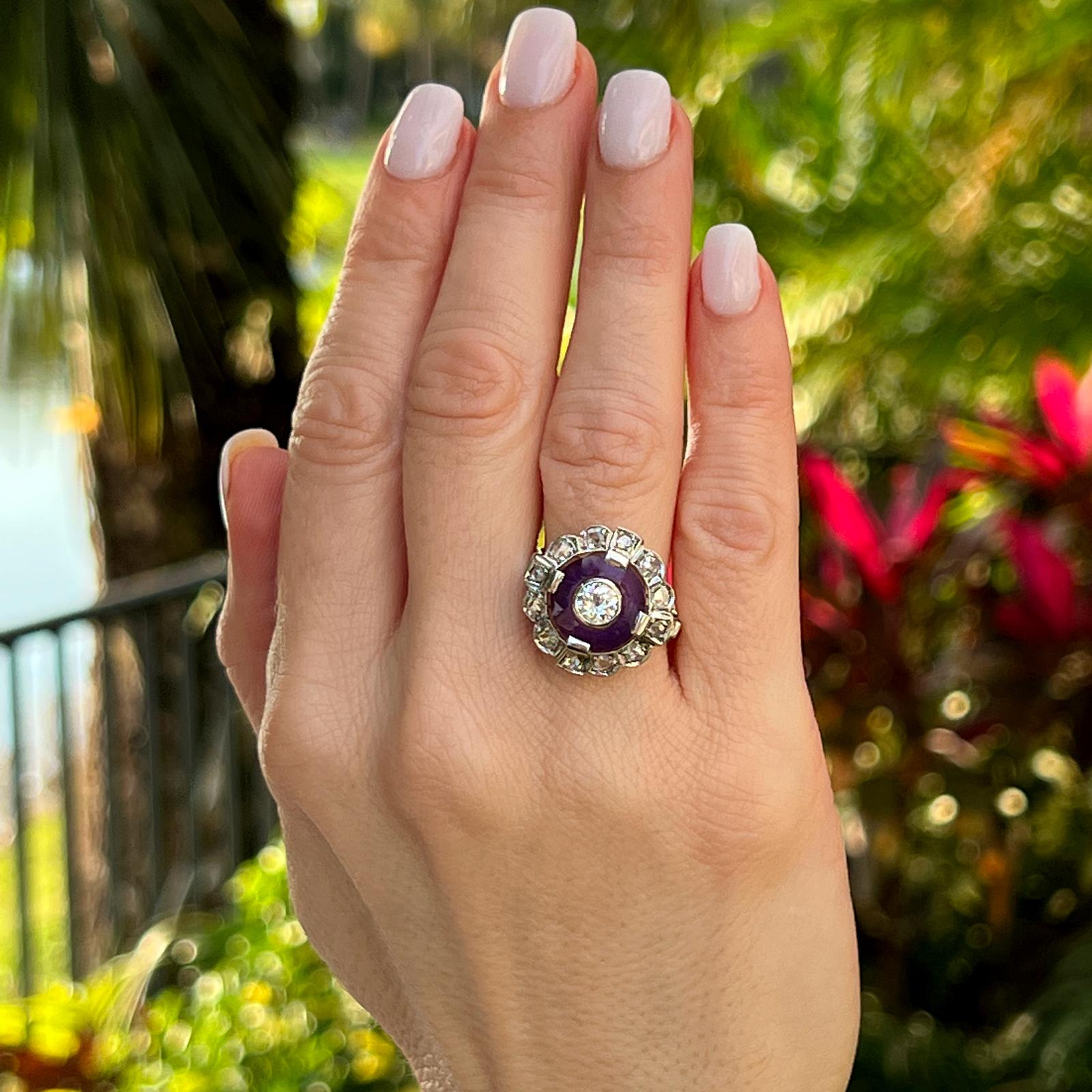 Gorgeous Art Deco diamond cocktail ring handcrafted with platinum on top and 14 karat yellow gold shank. The center Old European cut diamond weighs approximately .50 carat, is surrounded by a single amethyst carved gemstone and 12 rose cut diamonds