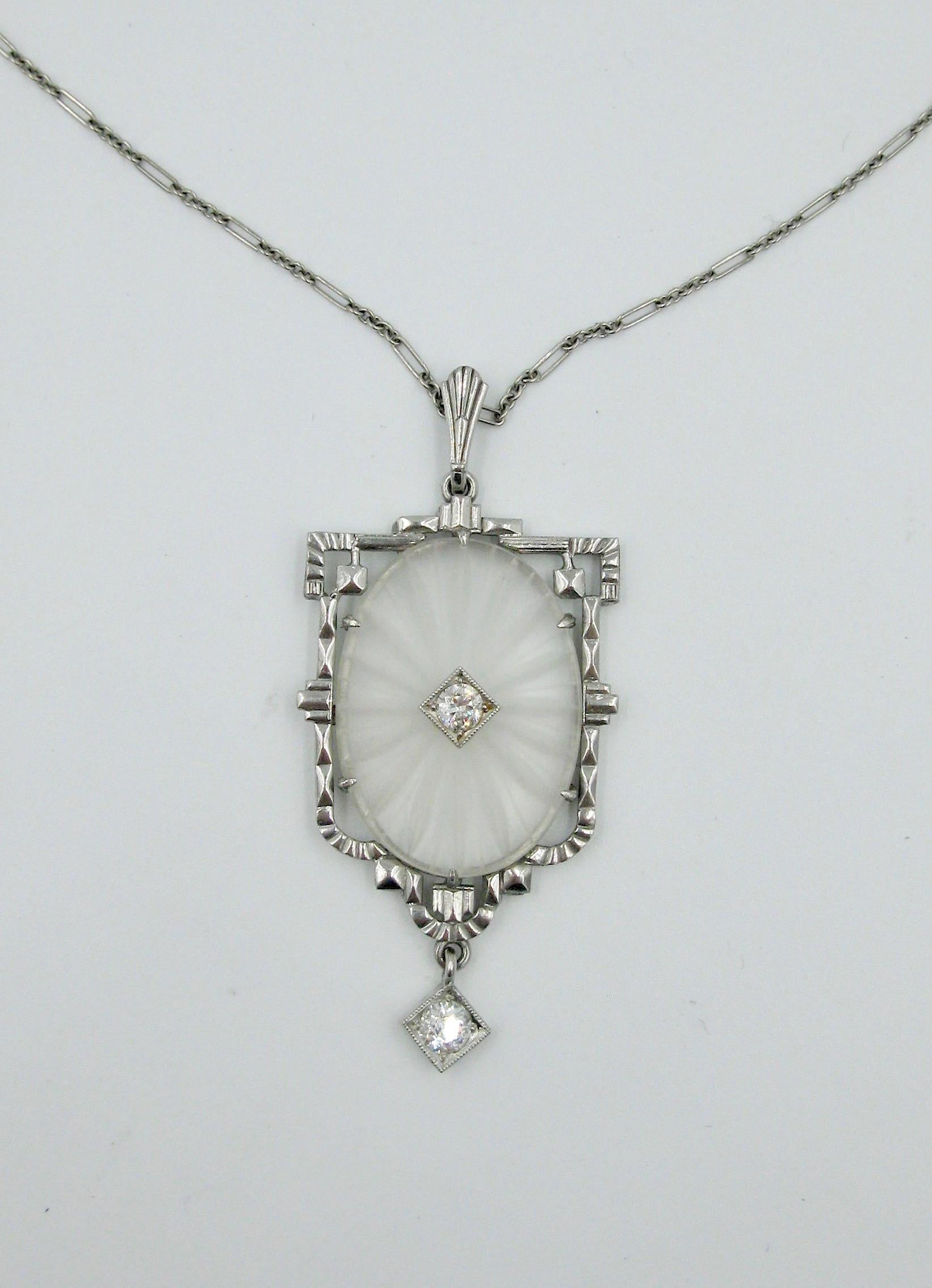 A stunning original Art Deco Pendant Necklace set with gorgeous Old European Cut Diamonds with an etched carved crystal oval center set in 14 Karat White Gold with a 14 Karat gold link chain.  A delicate romantic necklace dating to the Art Deco