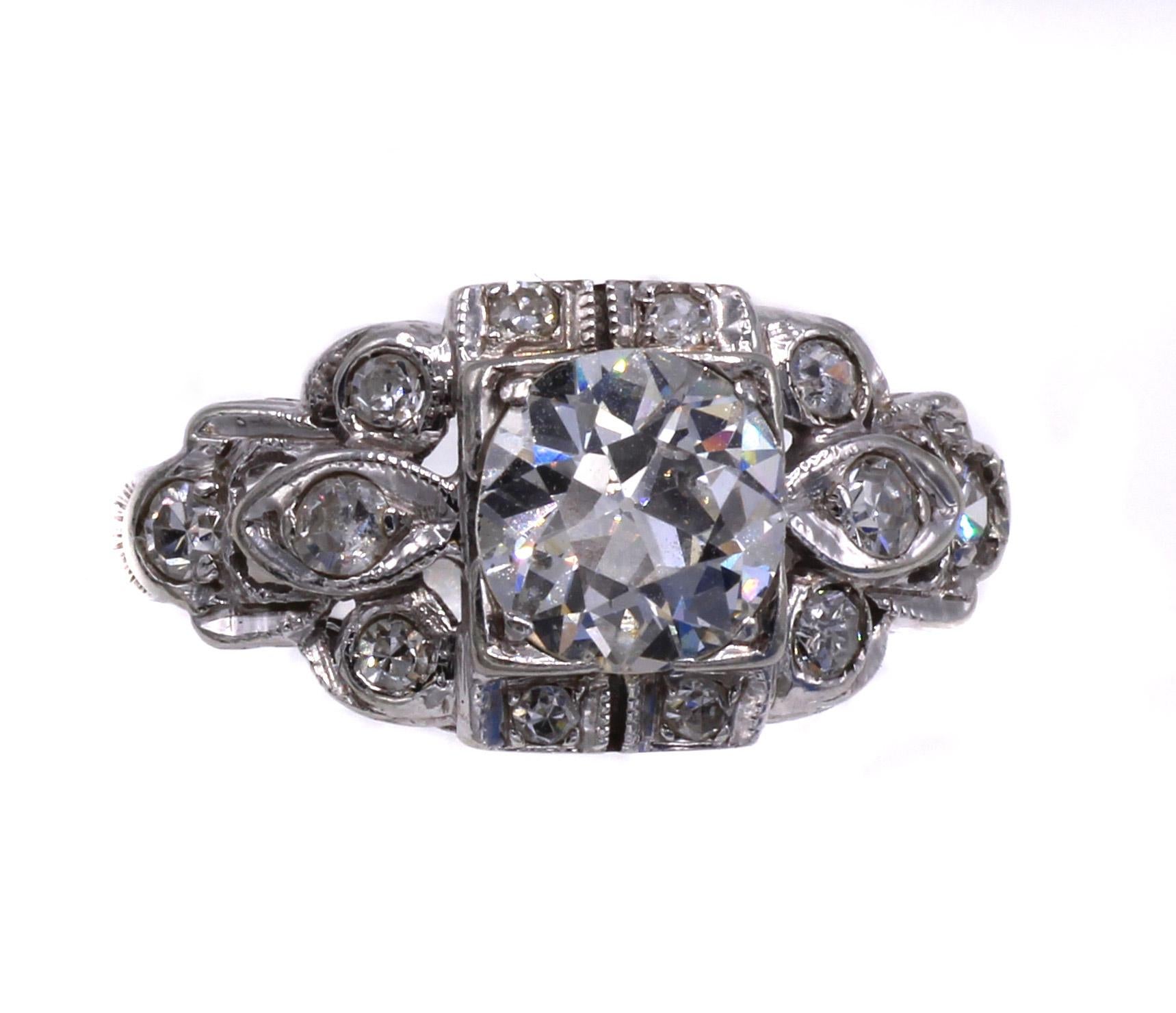Gorgeous Art Deco engagement ring centrally set with on lively Old European Cut diamond measured to weigh approximately 0.75 carats. Our inhouse certified gemmologist has graded the color J and the clarity SI. Further embellished by 12 old cut round