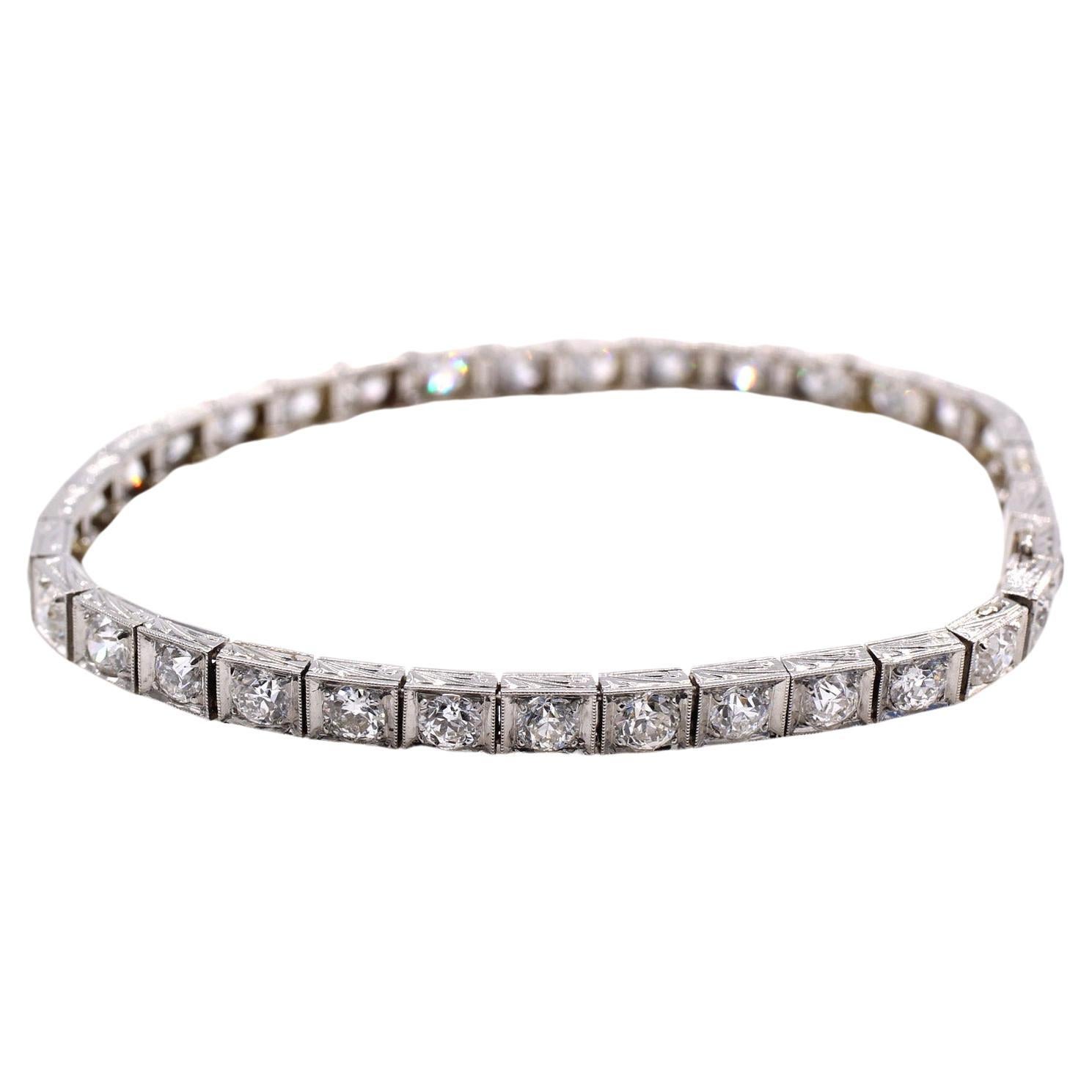 Finely handcrafted in ca. 1930 this wonderful and most wearable tennis- or straight-line bracelet features 34 perfectly matched white bright and sparkling Old European cut diamonds. The estimated total diamond weight is approximately 5.5 carats, and