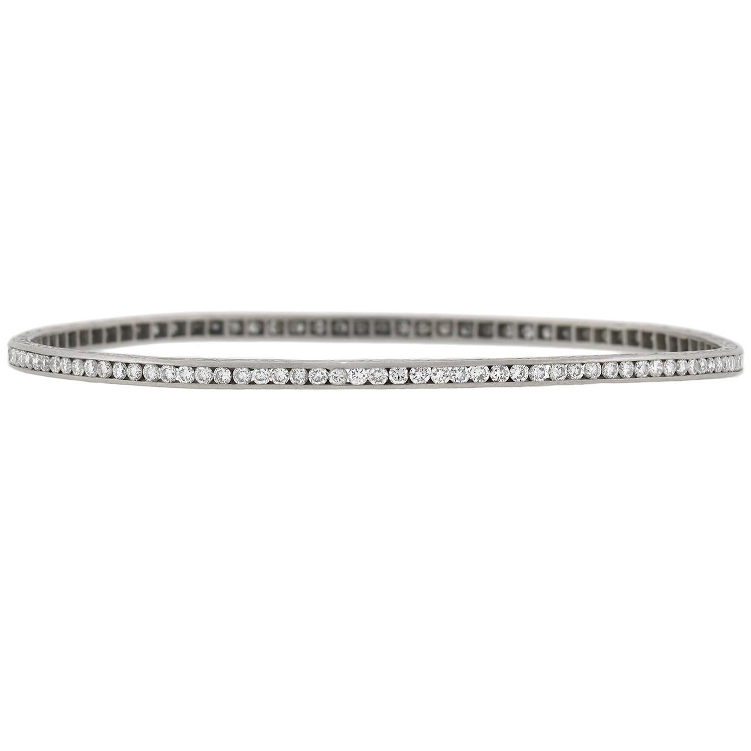 An absolutely stunning and unusual diamond bangle from the late Art Deco (ca1930s) era! This gorgeous oval-shaped bracelet is crafted in platinum and displays a sparkling surface lined with diamonds. With 90 stones in all, the old European Cut