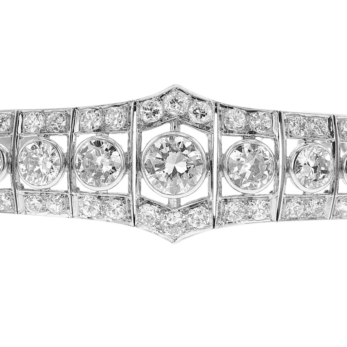 A Platinum Bracelet made with Graduating Round and Old-European Cut Diamonds. The length is 7¼ inches, and the width of the center of the bracelet is 0.82 inches. The three large diamonds weigh approximately 2.15, 0.95, and 0.90 carats, estimated at