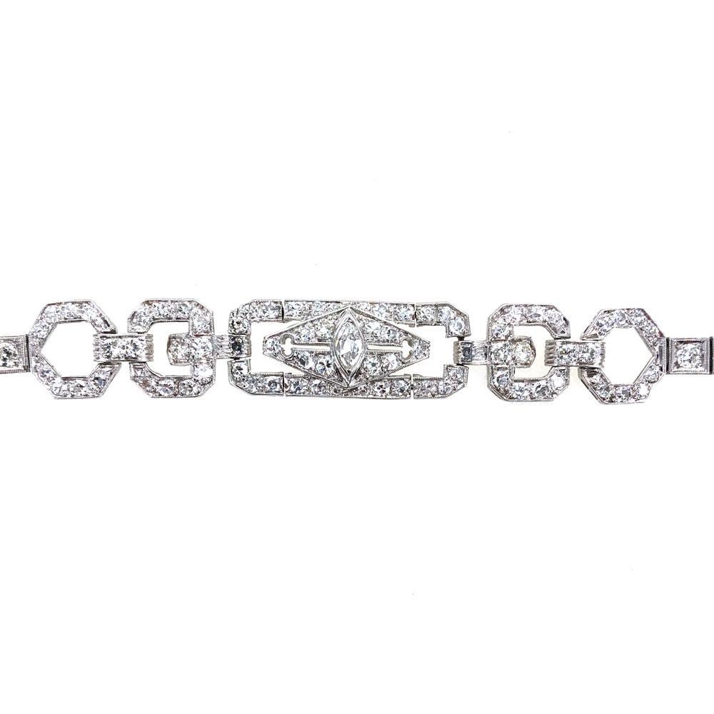 Gorgeous Art Deco diamond bracelet hand crafted in platinum. This diamond bracelet, circa early 1900's, features Old European Cut diamonds weighing 4.35 carat total weight. There is a single marquise cut diamond in the center of the bracelet. The