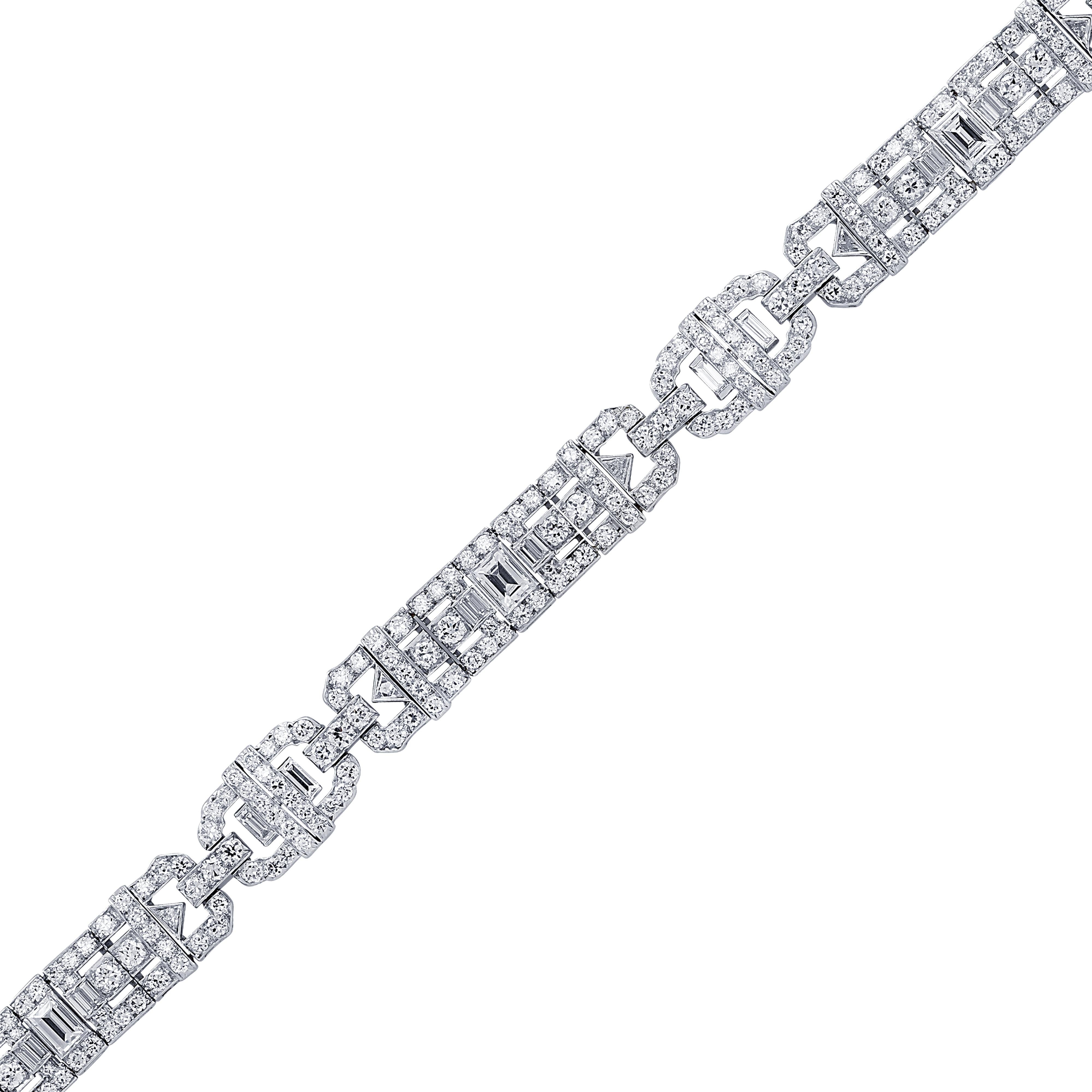 Gorgeous Art Deco bracelet crafted in platinum featuring 267 Old European, baguette, and trillion cut diamonds weighing approximately 10.0 carat total weight. The diamonds are graded G color and VS clarity. The bracelet measures 7.5 inches in
