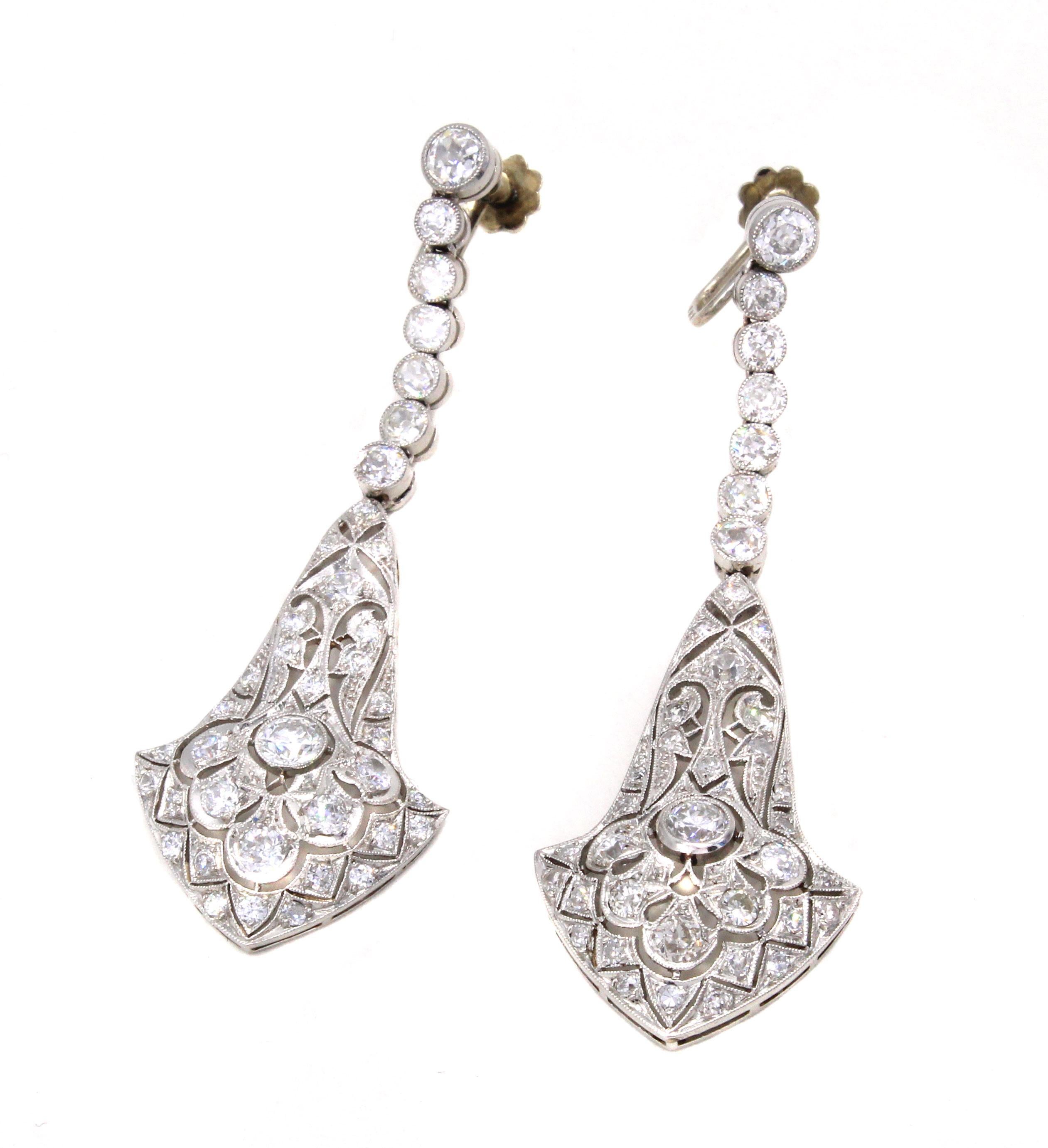 Beautifully designed and masterfully handcrafted in platinum these wonderful ear pendants form ca 1925 exemplify the creativeness of the Art Deco era. The bottom pendants of this earring have the typical geometric look with beautiful a-jour work and