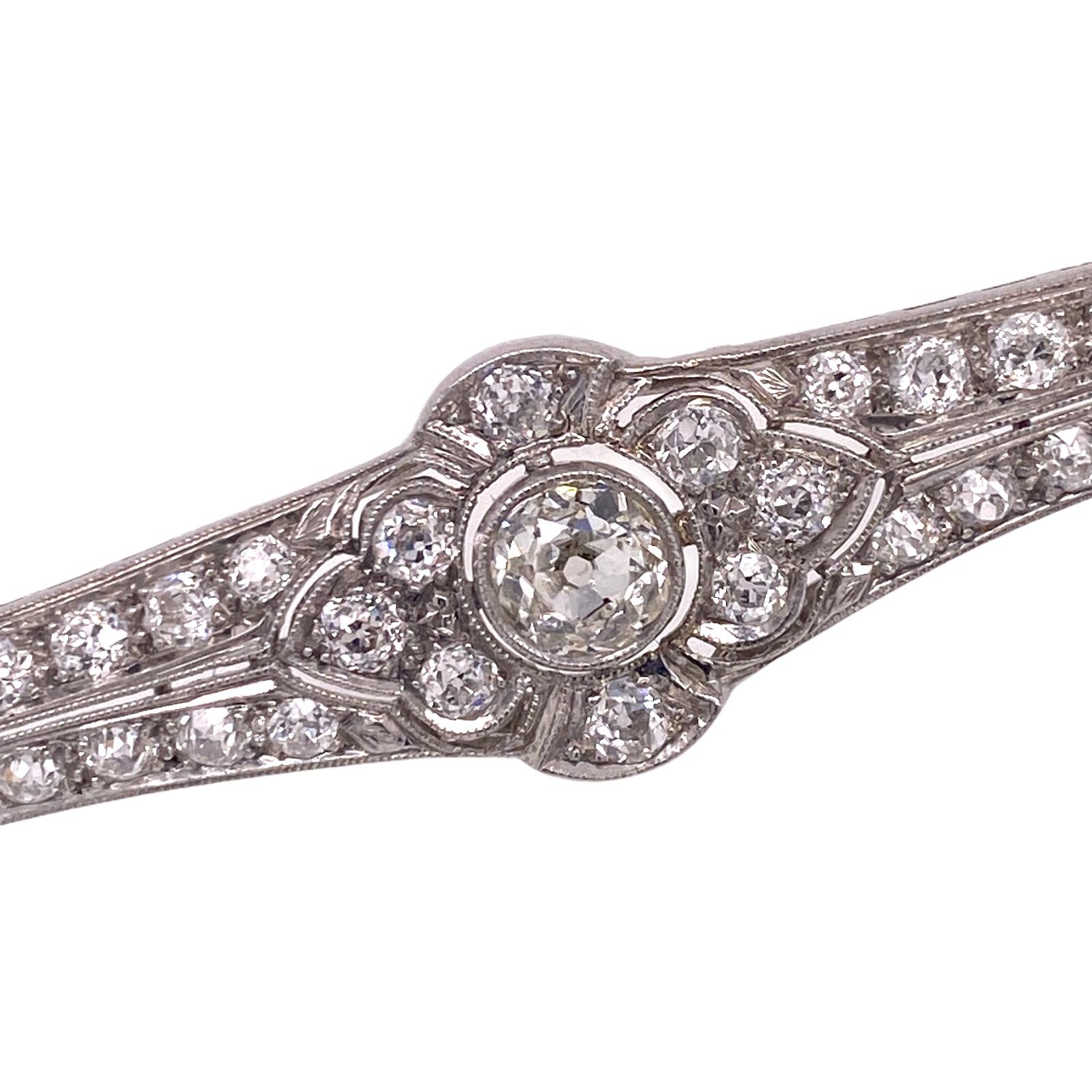 Original Art Deco Diamond brooch handcrafted in platinum. The brooch features a .54 carat Old European cut center diamond surrounded by another 36 Old European cut diamonds weighing a total of approximately 2.54 carat total weight. The diamonds are