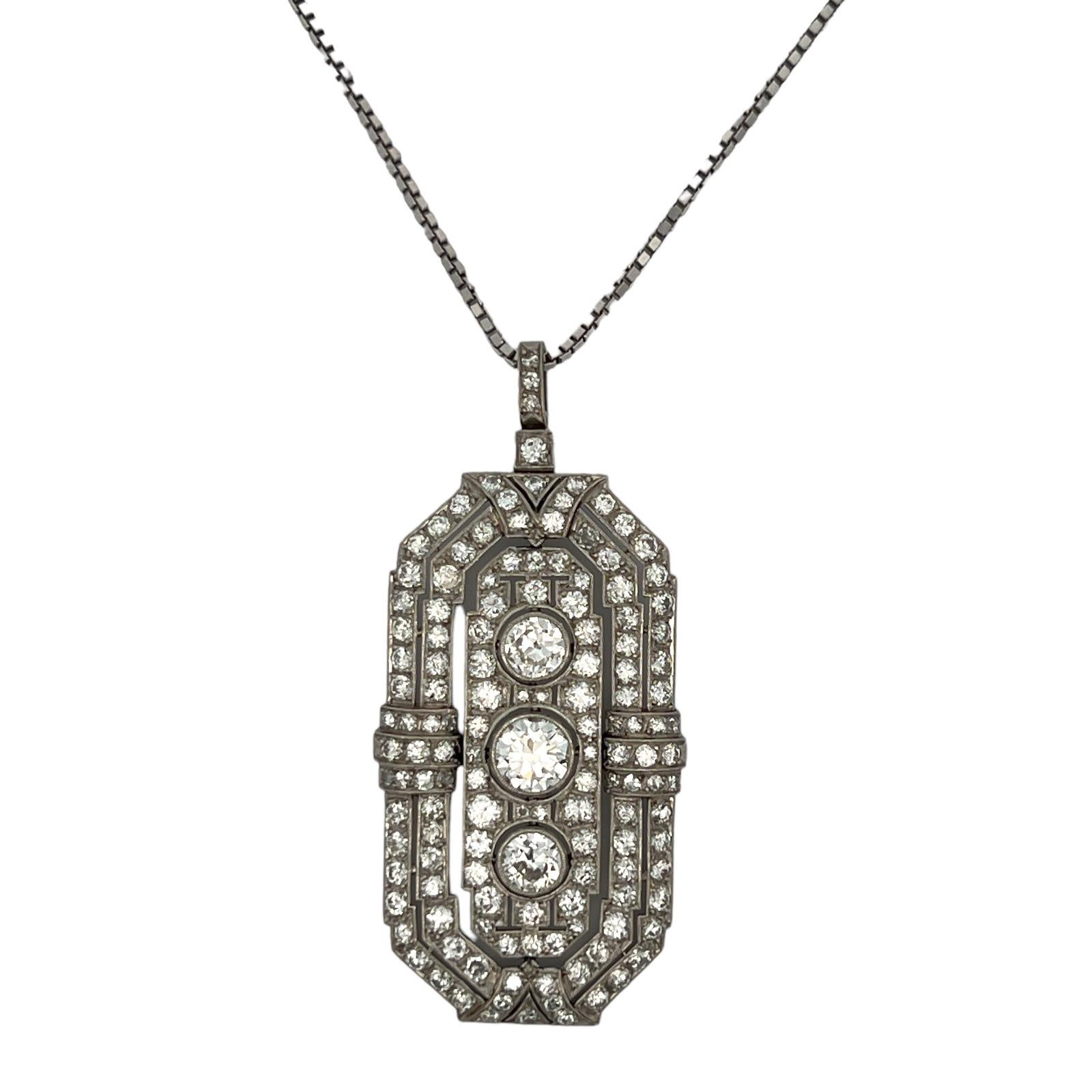 Original Art Deco diamond pendant handcrafted in platinum. The statement pendant features a center Old European cut diamond weighing approximately 1.22 carats. Two Old European diamonds weigh 1.16 CTW, and approximately 3.75 CTW in side diamonds