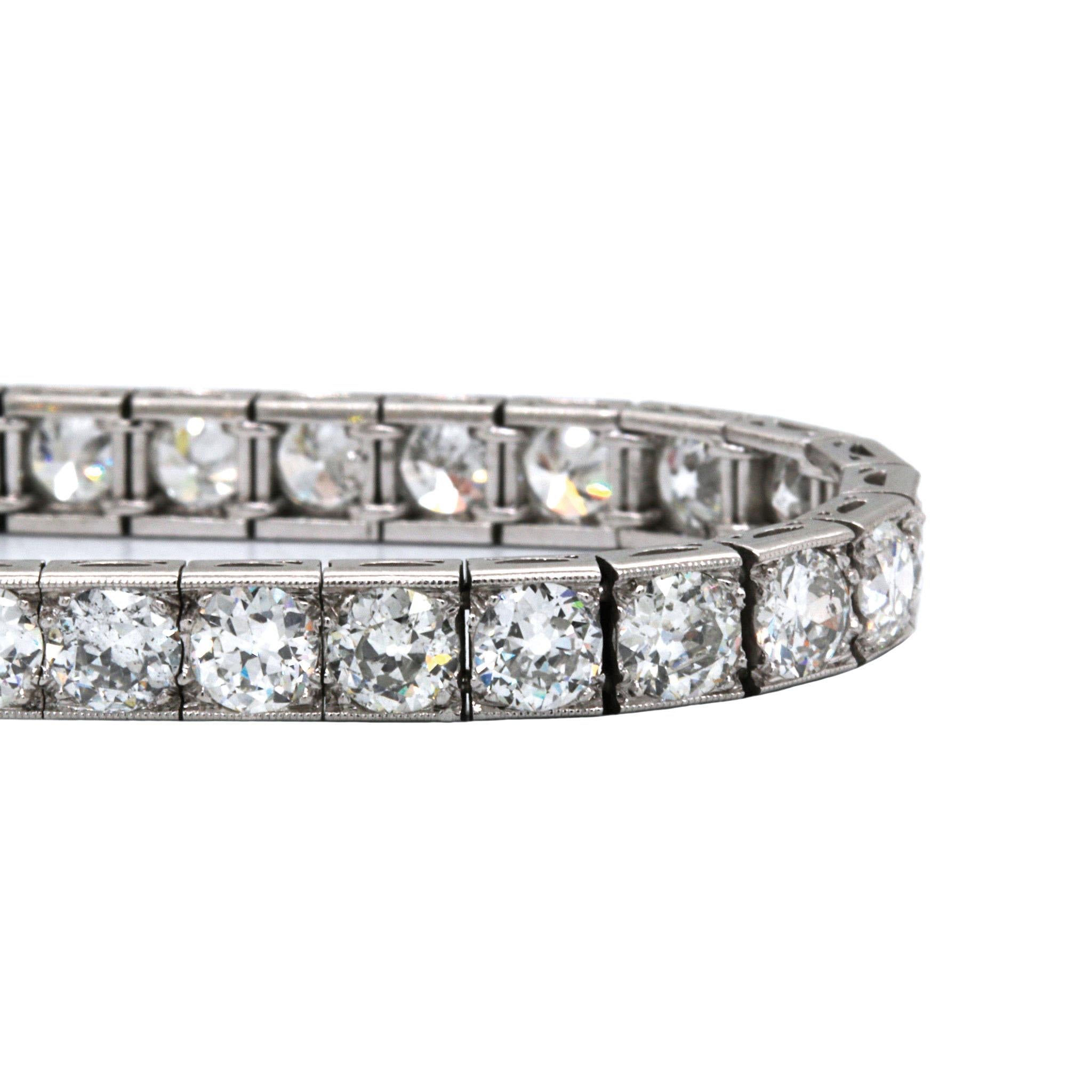 This sumptuous diamond bracelet features 9.54ctw of sparkling vintage Old European Cut diamonds; graded H-J in color, I1-VS2 in clarity. Set in platinum, the bracelet fastens securely via a push style clasp, which is further held in place with a
