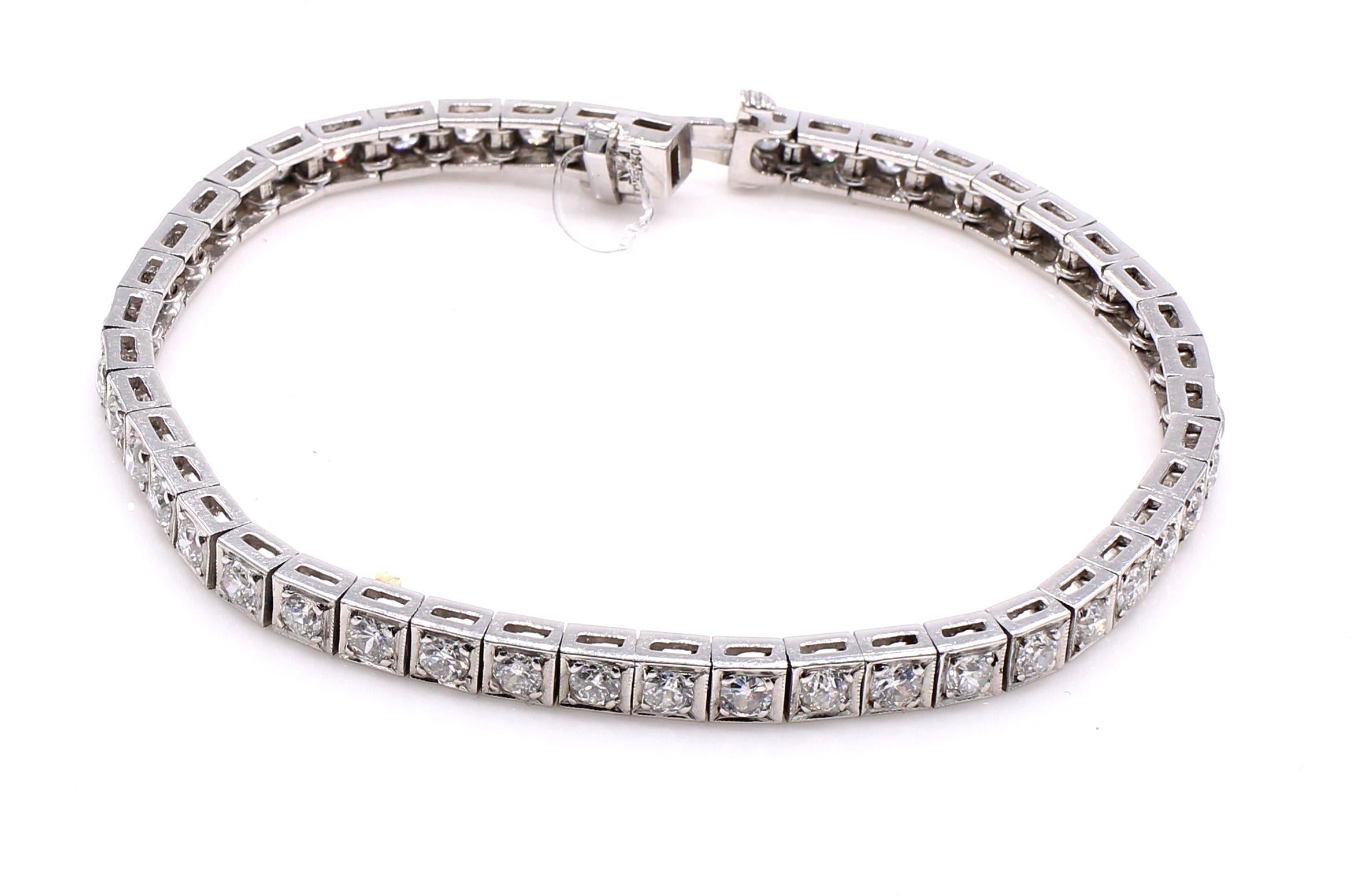Wonderfully handcrafted this Art Deco diamond line bracelet from ca 1935 is the most wearable every day piece of jewelry for all occasions. Set in platinum with 45 perfectly matched Old European cut diamonds this bracelet sparkles on the wrist. The