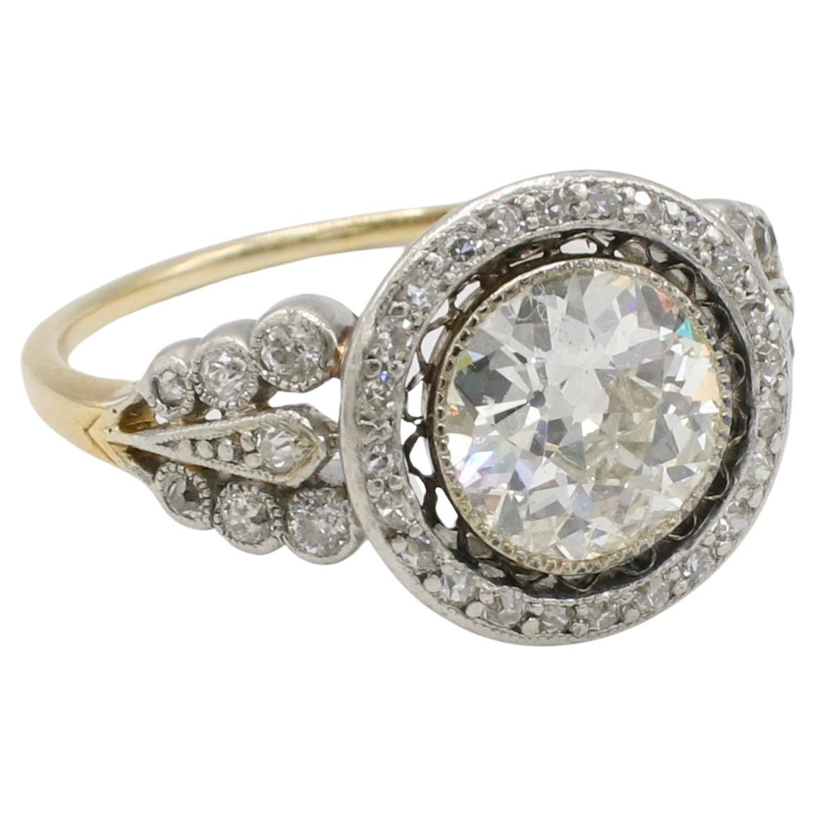 Art Deco Old European Cut Natural Diamond Engagement Ring 
Metal: 14K yellow gold & platinum
Weight: 4.80 grams
Diamond: Old European cut approx. 1.80 carat J SI1 natural diamond
Accent diamonds: Approx. .40 CTW I-J VS old European cut and single
