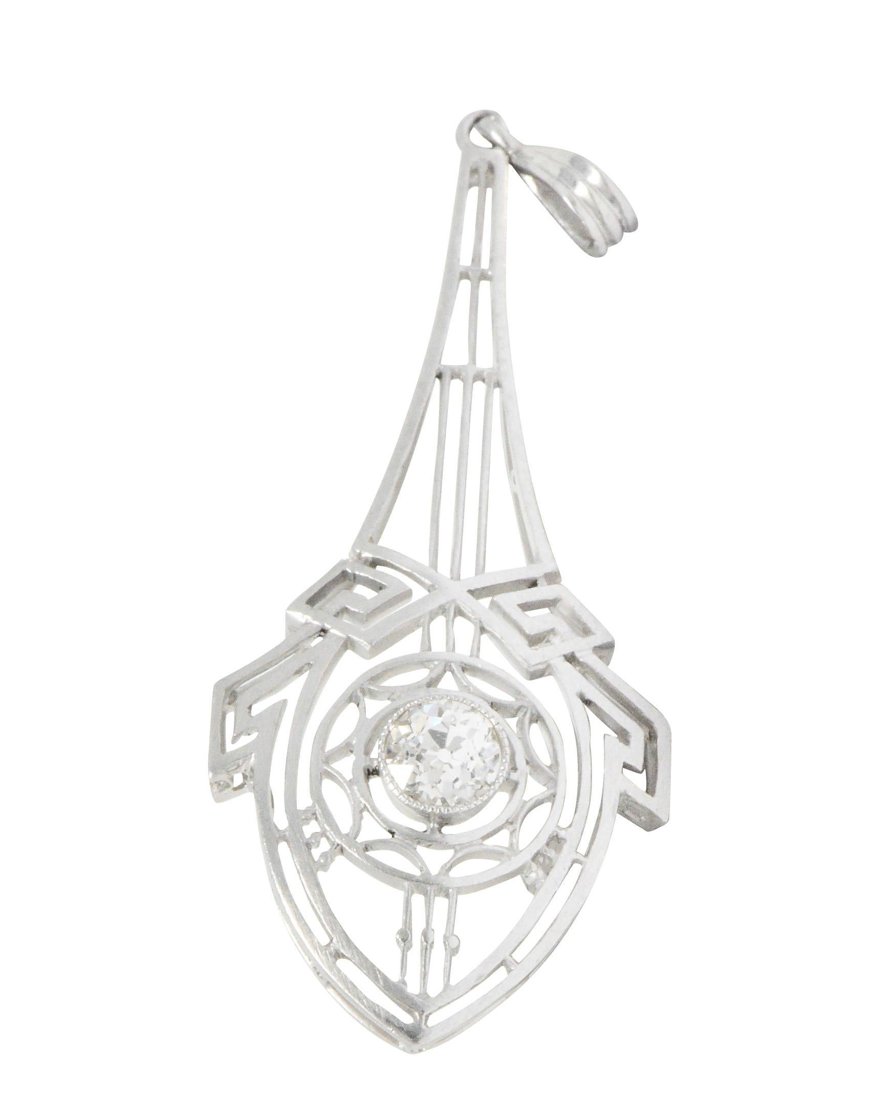 Pendant is a pierced geometric design featuring Greek key motif and scallop accents

Centering a bezel set old European cut diamond weighing approximately 0.25 carat, K color with VS clarity

Completed by a deeply ridged bale

Tested as