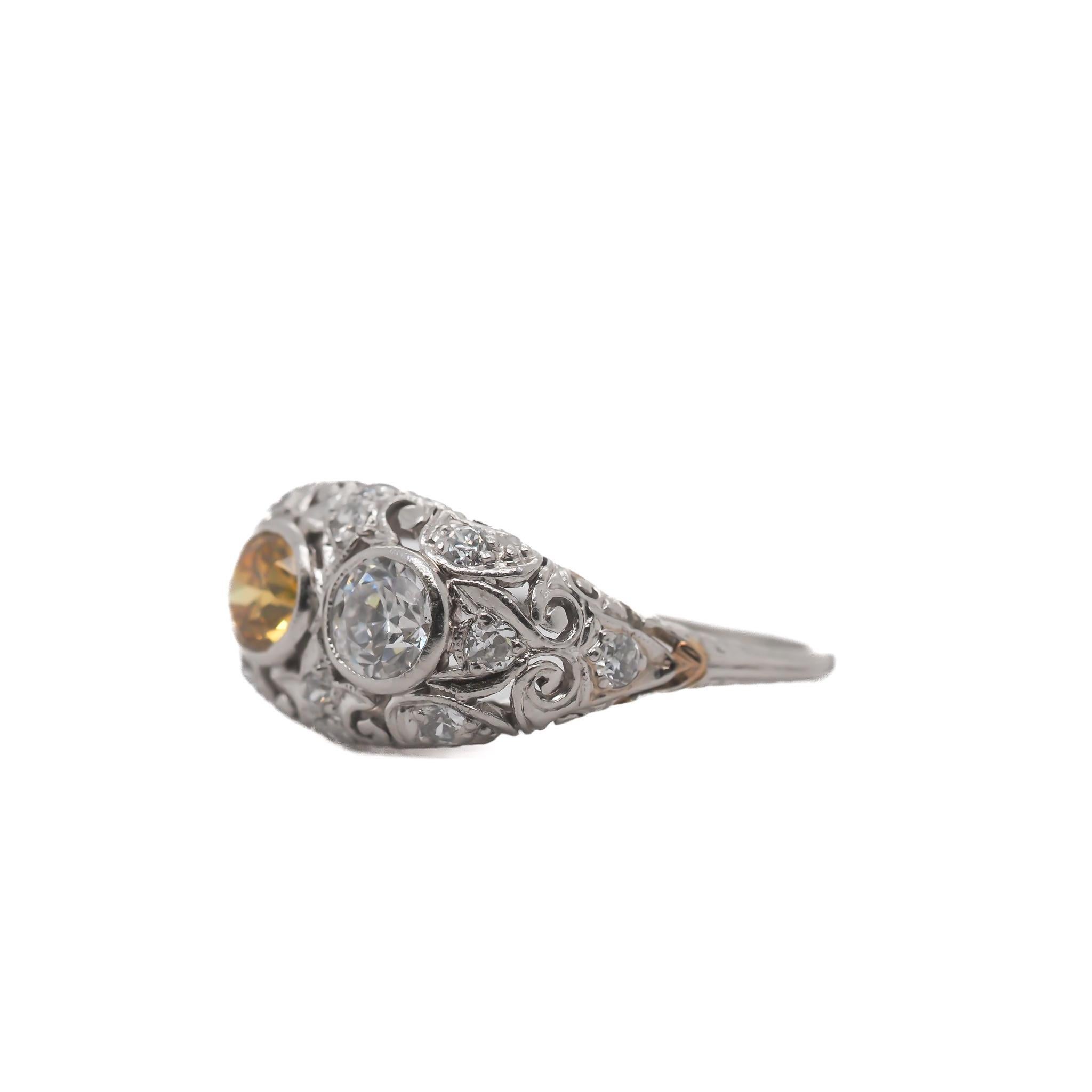 Item Details:
Ring Size: 7
Metal Type: Platinum
Weight: 3.50 grams

Main White Diamond Details
Shape: Old European Brilliant
Carat Weight: .50ct (Approximate)
Color: I
Clarity: VS1

Main Yellow Diamond Details
Shape: Old European Brilliant
Carat