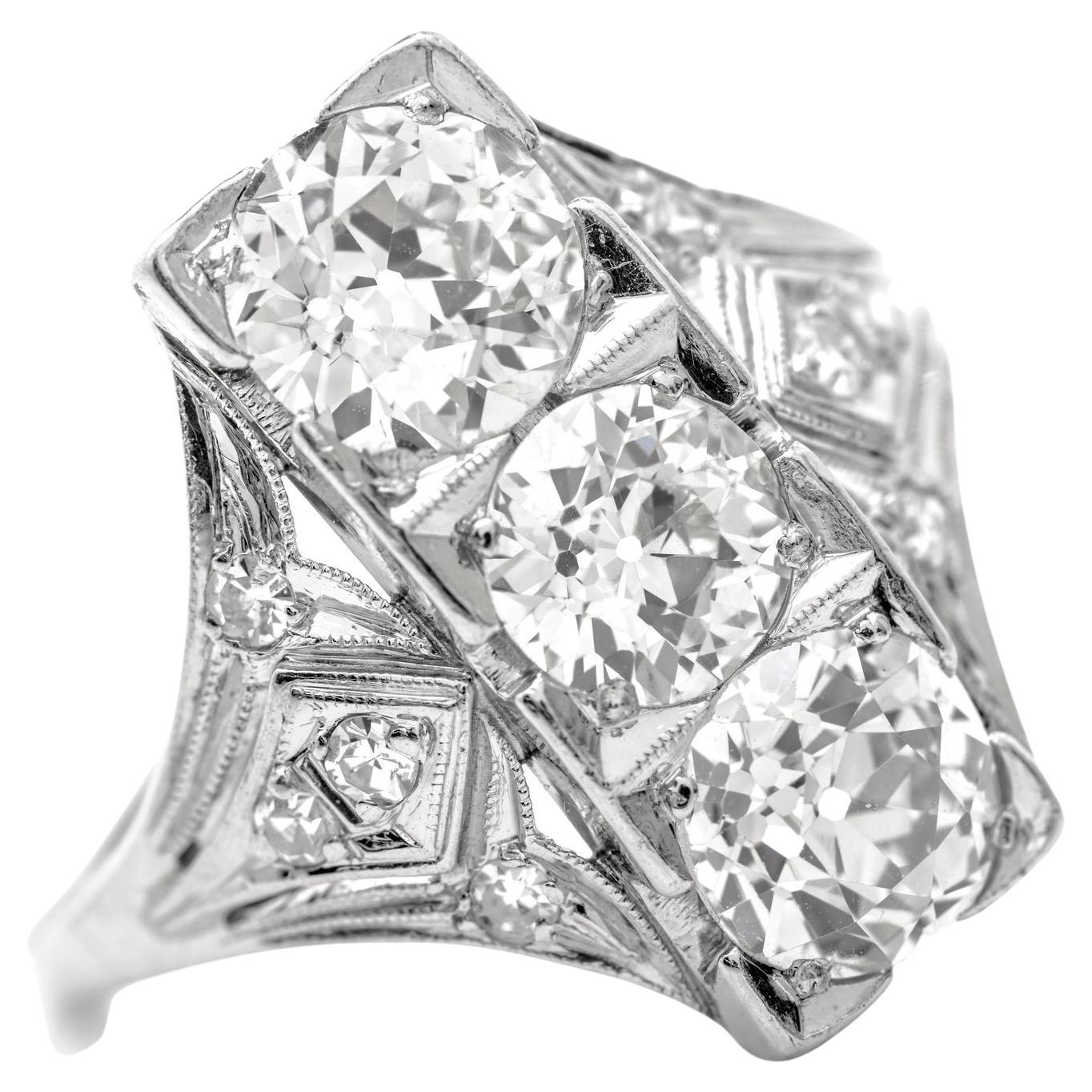 Amazing Sparkle, are the two perfect words for this piece,

Crafted in solid Platinum, the center is adorned by  (3) European Cut Diamonds weighing approx. 3.40 carats in total H-I color, VS. One diamond is GIA certified to be natural diamonds, and
