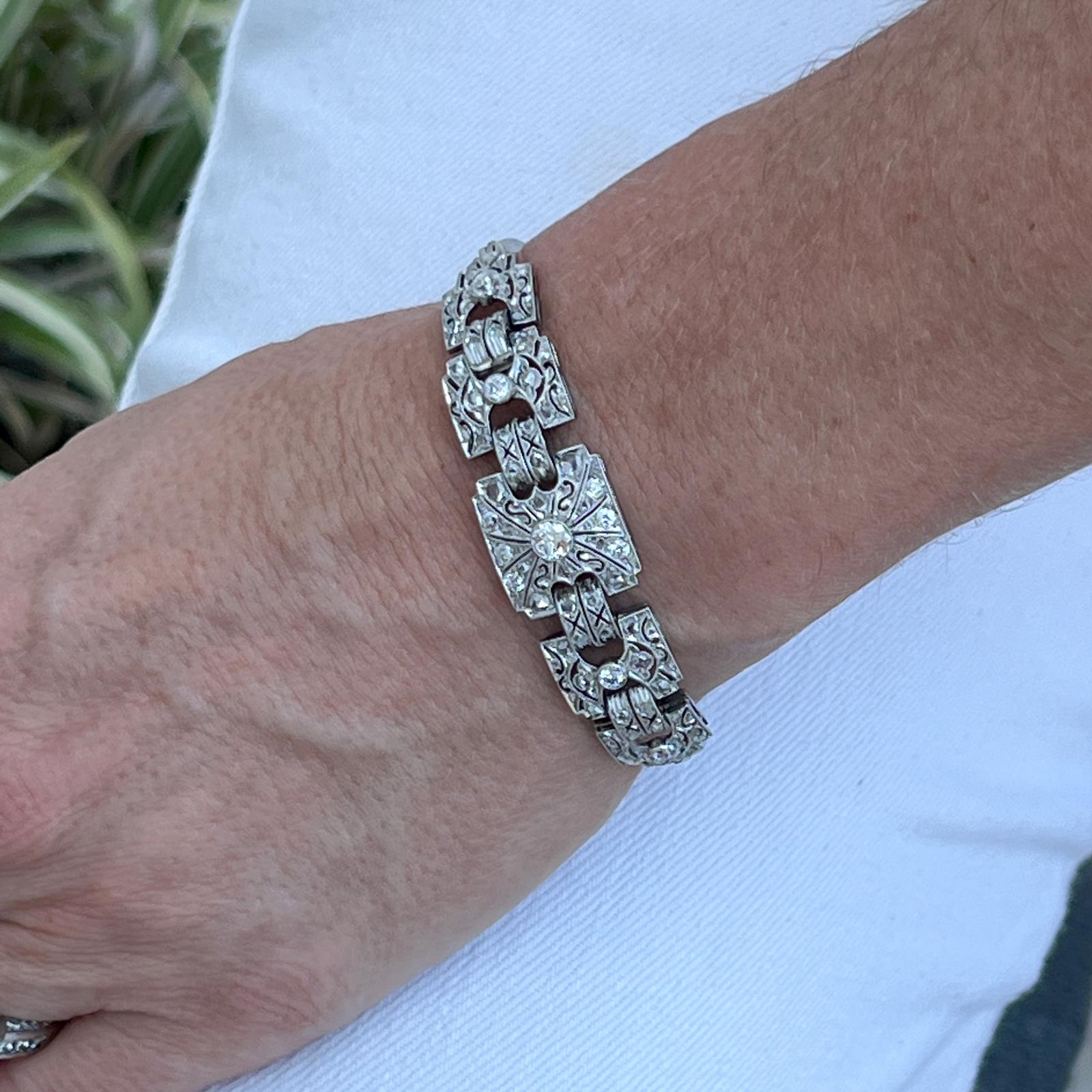 Beautiful and feminine Art Deco diamond bracelet handcrafted in platinum. The bracelet features 11 Old European and Old Mine cut diamonds weighing approximately 1.22 carat total weight as well as 62 rose cut diamonds weighing approximately .80 CTW