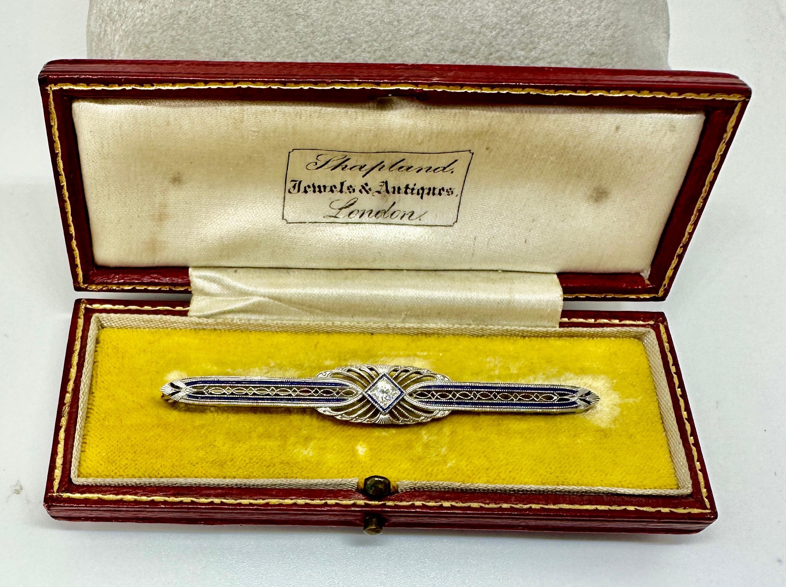 This is a stunning antique Art Deco - Edwardian Old Mine Cut Diamond and Royal Blue Enamel Bar Brooch Pin in 14 Karat White Gold.  The brooch is in its original fitted red leather and silk and velvet lined box from London.  The gorgeous brooch is
