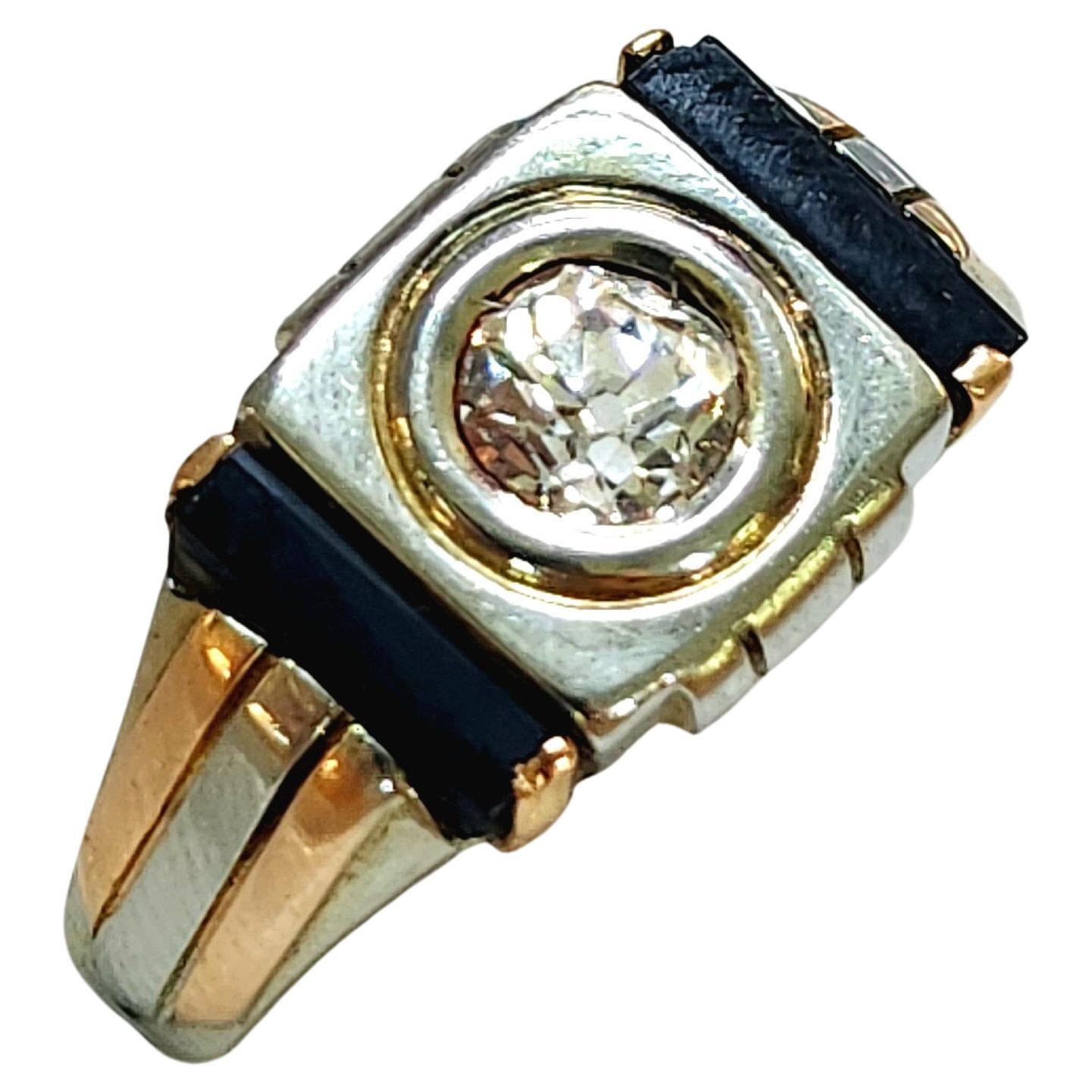 Antique Art Deco mans Ring in 2 tone 18k gold color centered with old mine cut diamond estimate weight 0.60 carats H color white vs clearity flanked with black onyx stones dates back to tje art deco era 1920/1925s