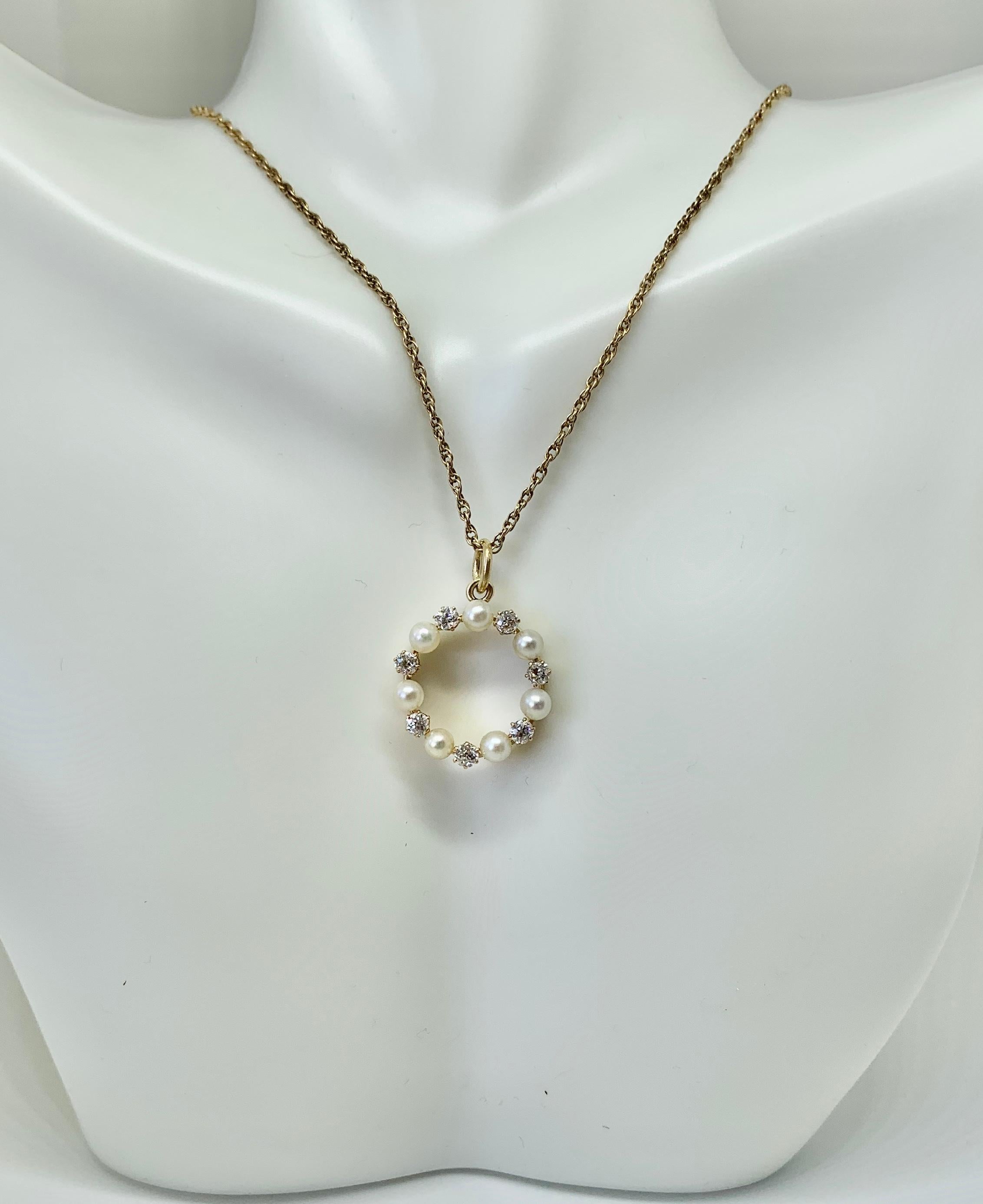 This is a beautiful antique Old Mine Cut Diamond and Pearl Victorian - Art Deco Circle Pendant.  The pendant is set with seven Old Mine Cut Diamonds of superb quality.  The antique diamonds are brilliantly white and approximately G-H color. They