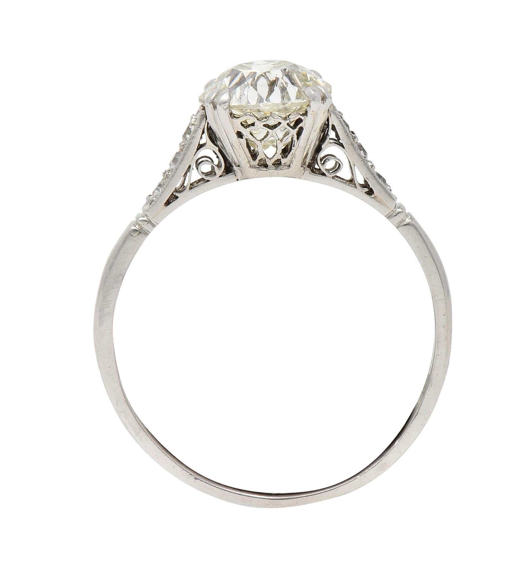 Art Deco Old Mine Cut Diamond Platinum Scrolling Vintage Engagement Ring In Excellent Condition For Sale In Philadelphia, PA