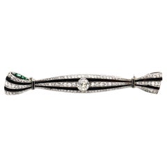 Antique Art Deco Onyx 0.94 Carat Diamond Platinum Bow Brooch, circa 1920