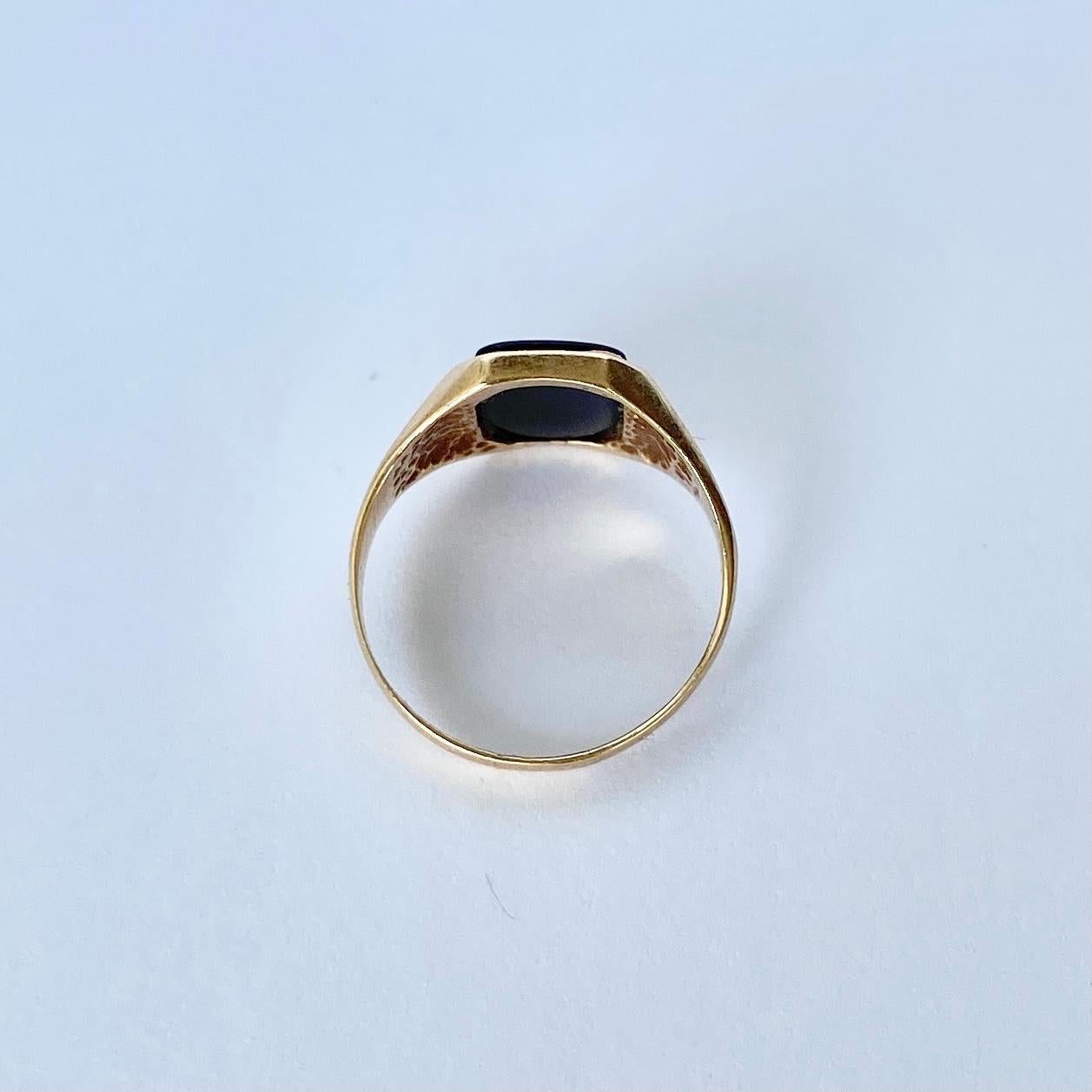 The onyx in this signet ring is in lovely condition and it so glossy! The stone is set within the 9ct gold chunky band. Hallmarked London. 

Ring Size: I 1/2 or 4 1/2 
Stone Dimensions: 9x7mm 

Weight: 1.6g