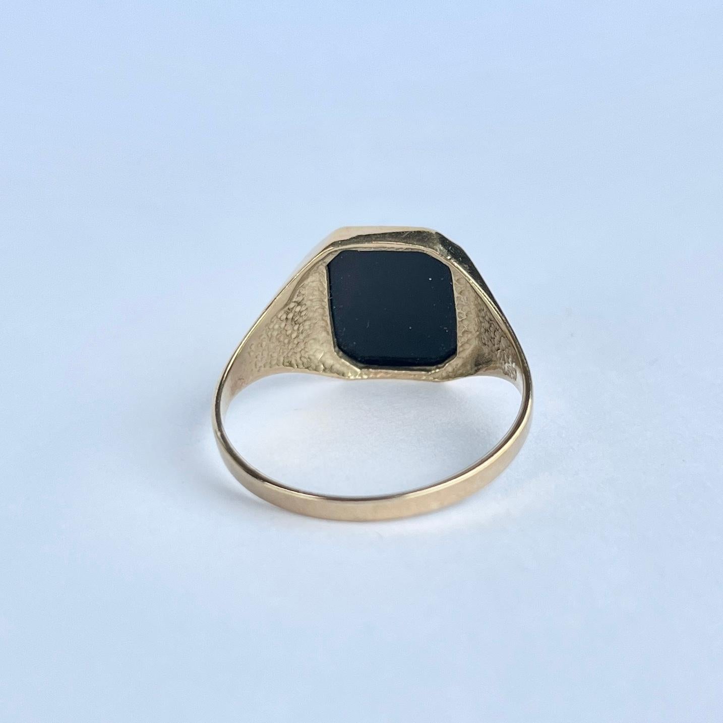 The Onyx stone is set within the 9ct gold band.   

Ring Size: V or 10 1/2 
Stone Dimensions: 12x10mm 

Weight: 3g