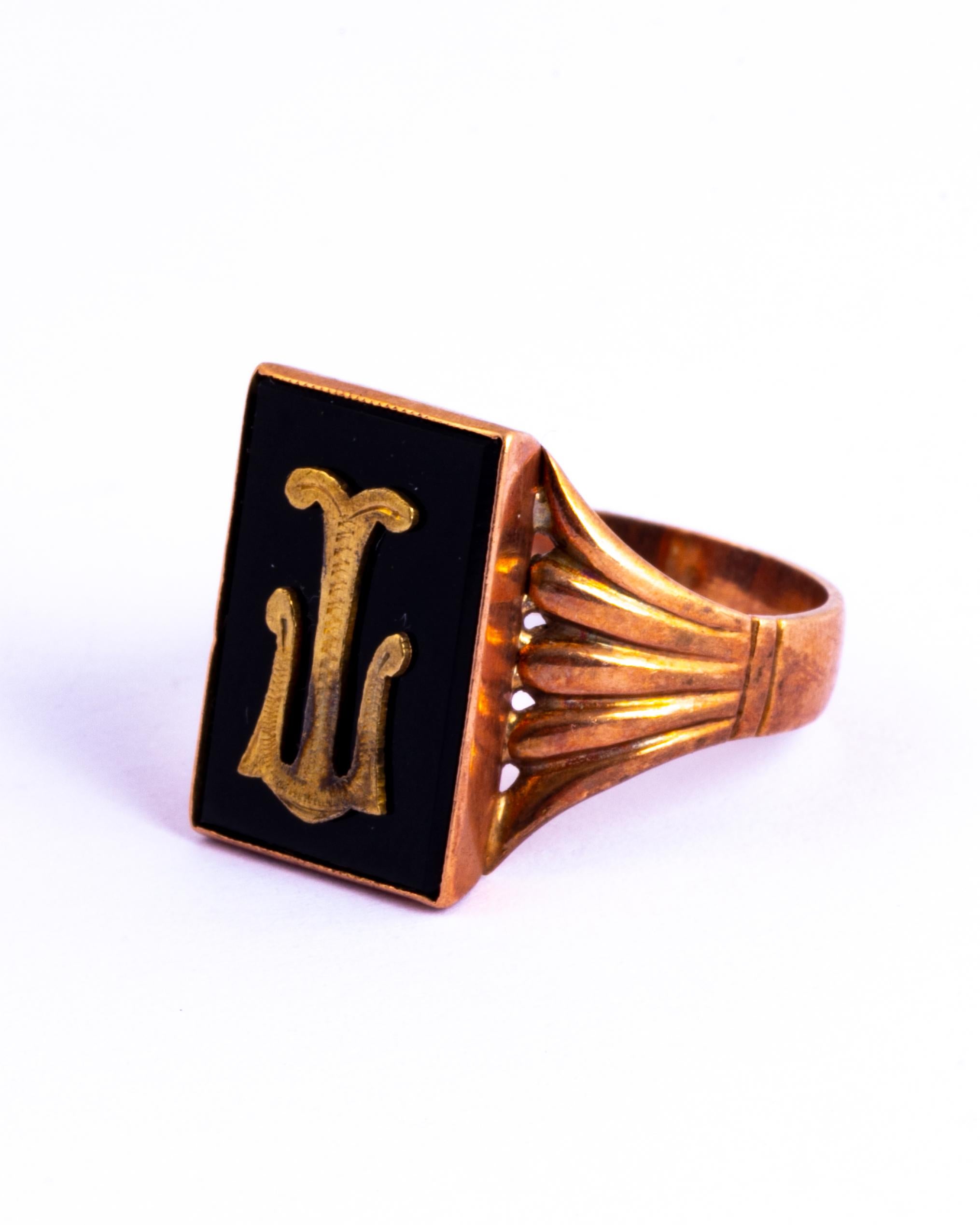 This ring holds a rectangular onyx stone which has the letter 'T' which lays over the top. The shoulders have classic art deco shell style to them. Modelled in 9carat rose gold. 

Ring Size: V or 10 1/2
Face Dimensions: 12x18mm

Weight: 5.5g