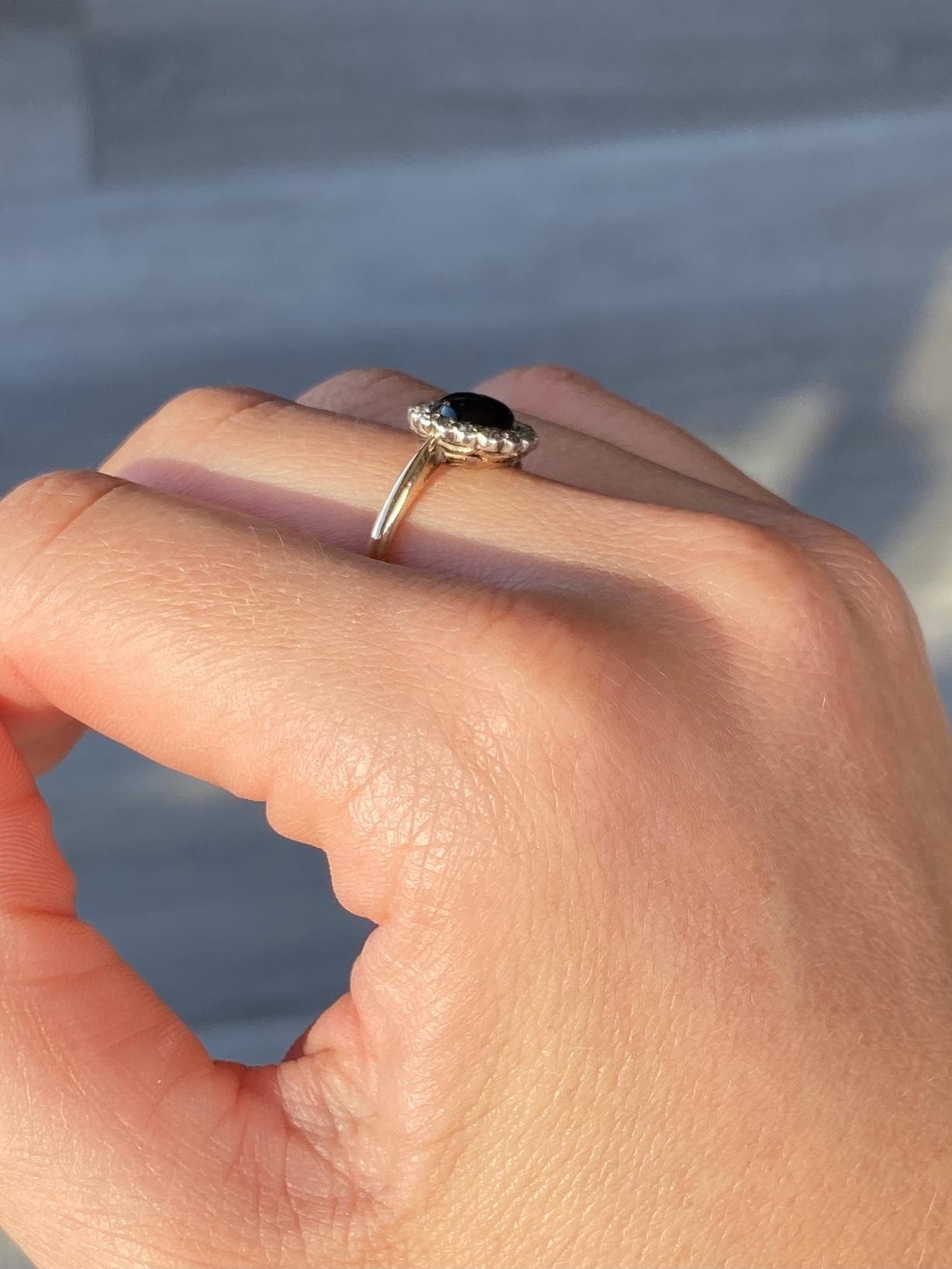 The onyx in this cluster ring is in lovely condition and it so glossy! The stone is surrounded by diamonds which total 35pts. Modelled in 18carat gold. 

Ring Size: L 1/2 or 6
Cluster Diameter : 11mm 

Weight: 2.1g