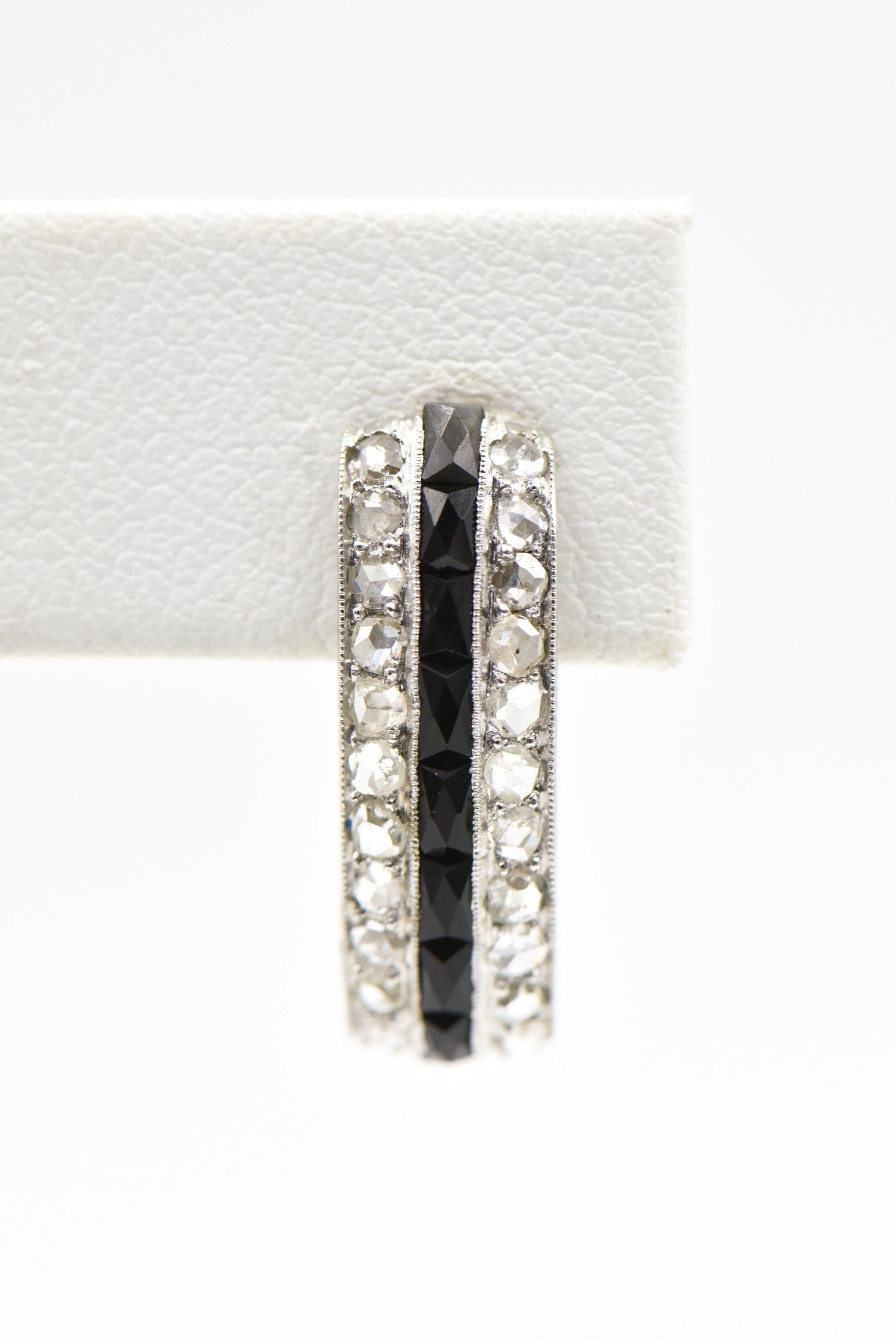Beautifully made art deco hoop platinum earrings featuring a line of channel set onyx between 2 rows of rose cut diamonds.  The sides are nicely etched with wheat design.  The backs have been replaced with 14k white gold monster backs.  The earrings