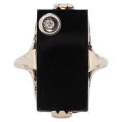 Bague Art déco en onyx et diamants. Bague rectangulaire en or jaune 14 carats avec onyx et diamants
