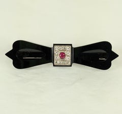 Art Deco Onyx Diamond and Ruby Bow Brooch