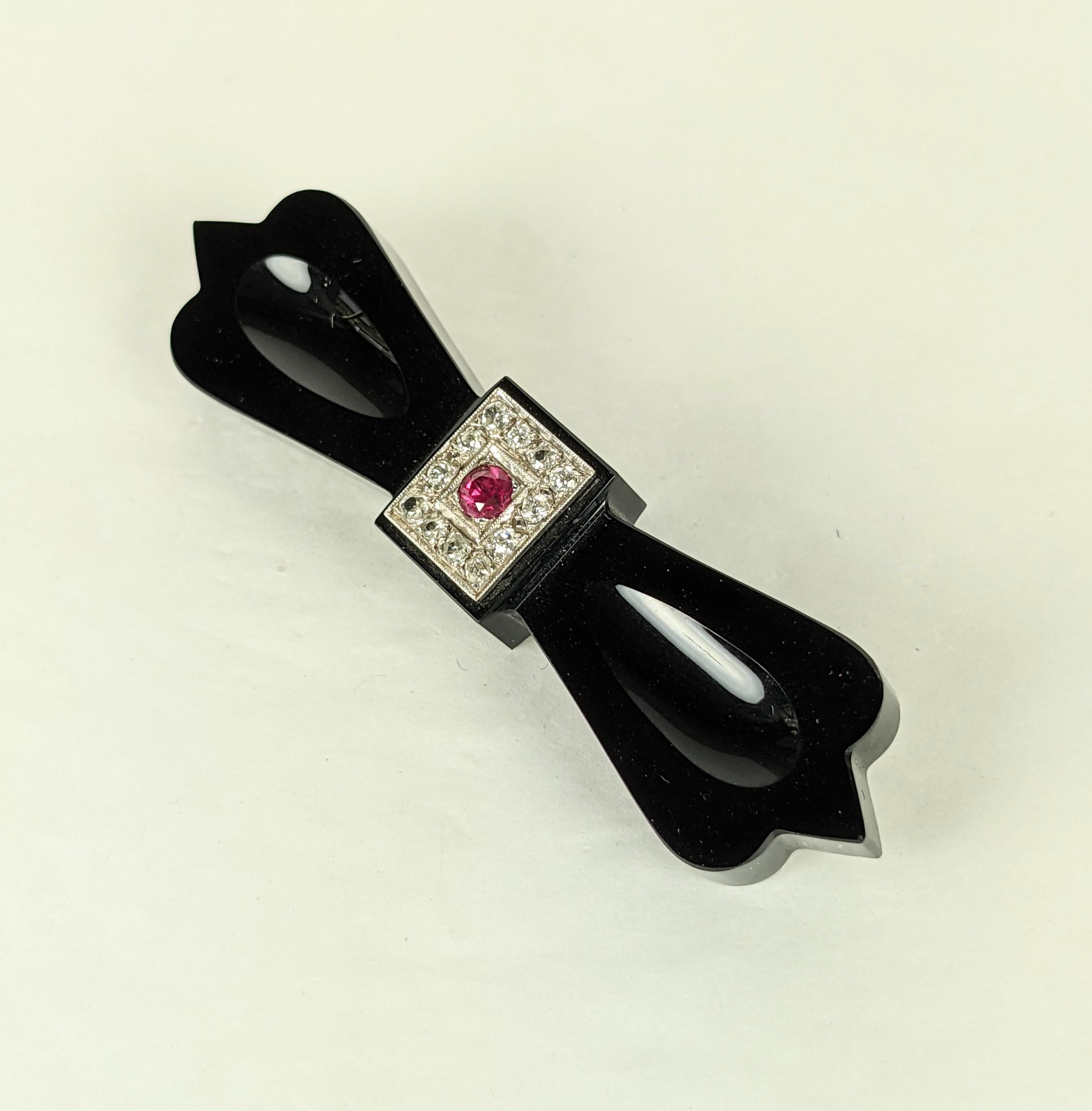 Round Cut Art Deco Onyx Diamond and Ruby Bow Brooch For Sale