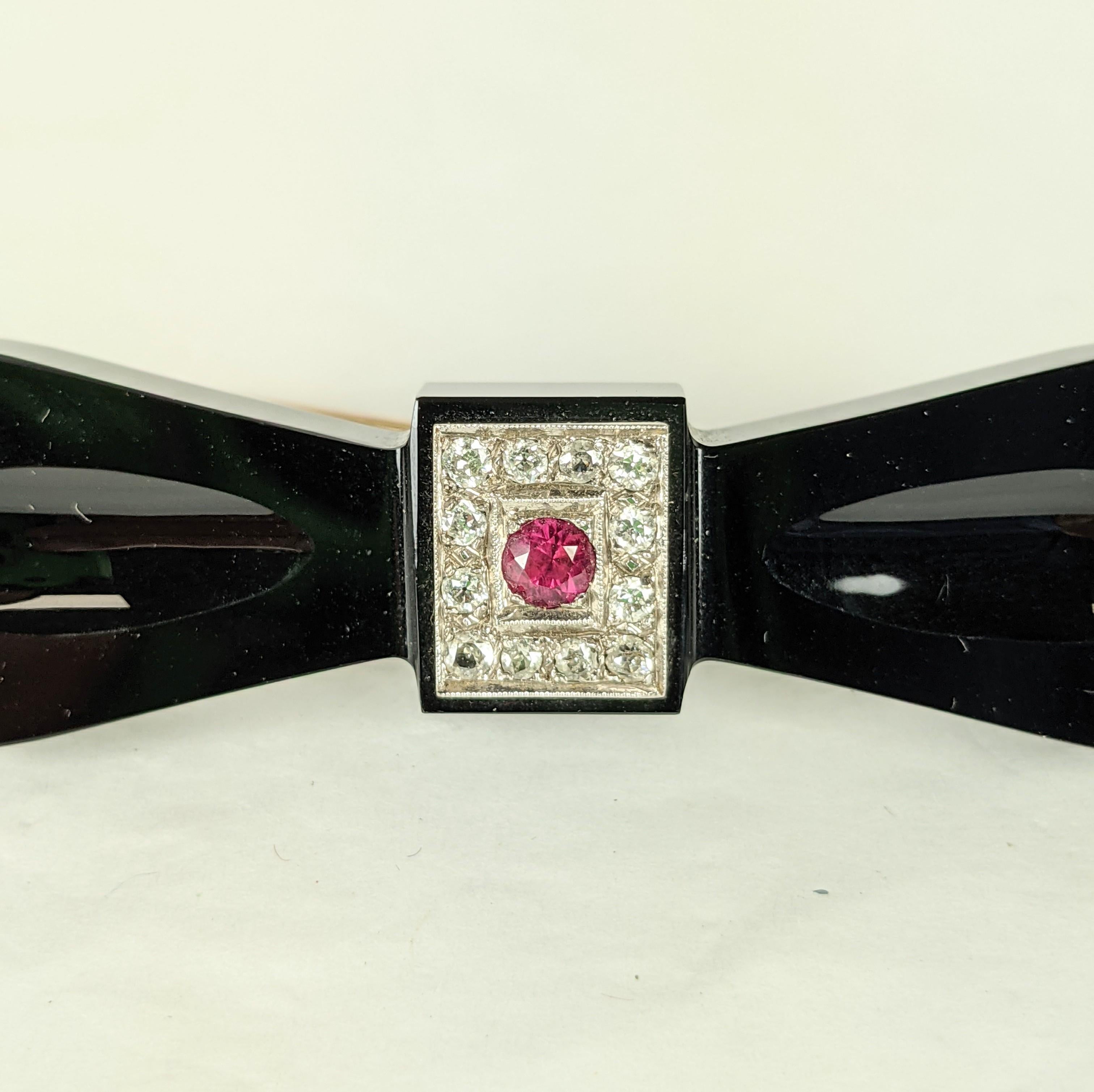 Art Deco Onyx Diamond and Ruby Bow Brooch In Excellent Condition For Sale In New York, NY