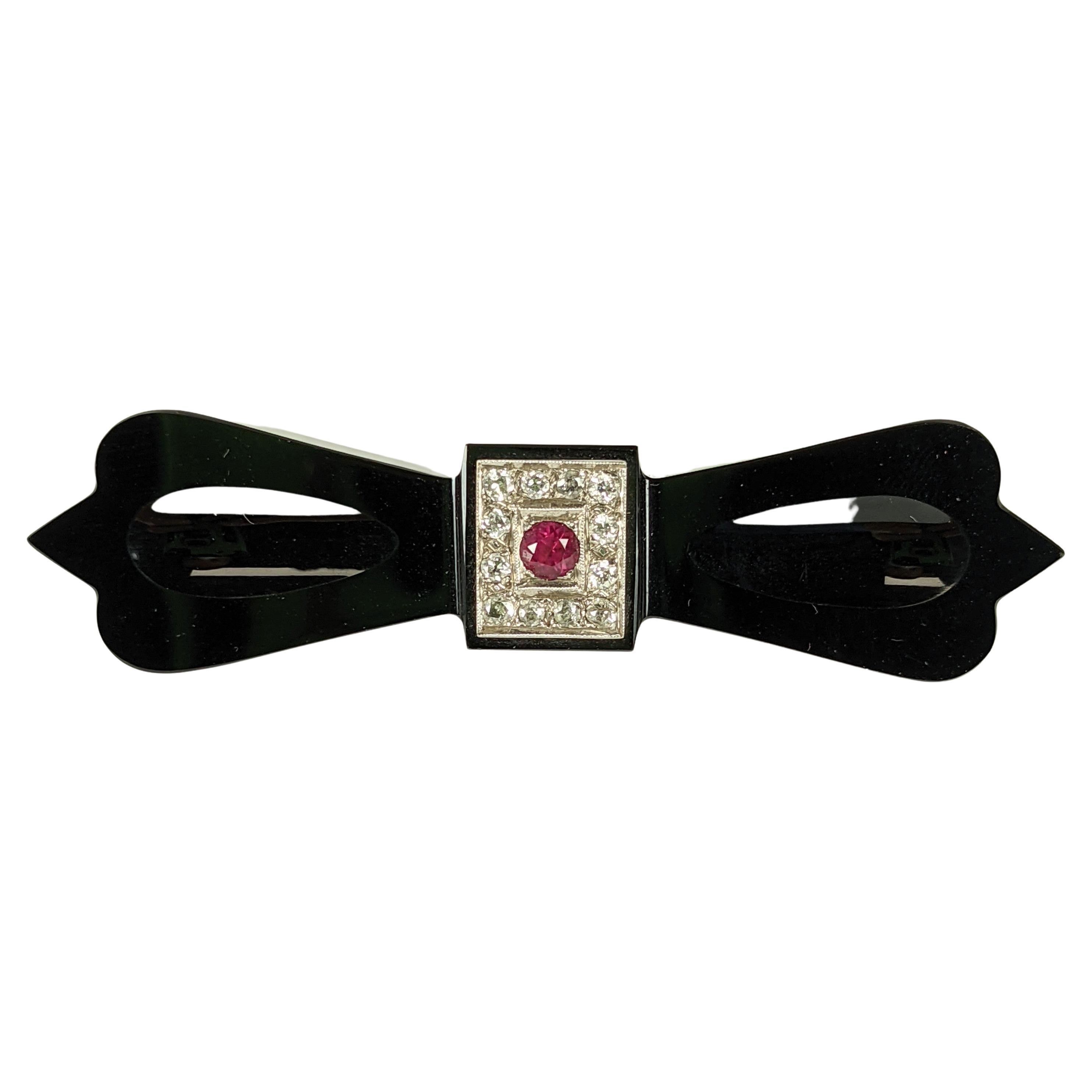 Art Deco Onyx Diamond and Ruby Bow Brooch For Sale