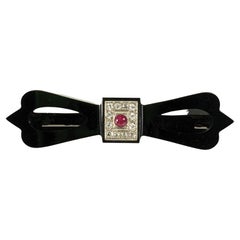 Antique Art Deco Onyx Diamond and Ruby Bow Brooch