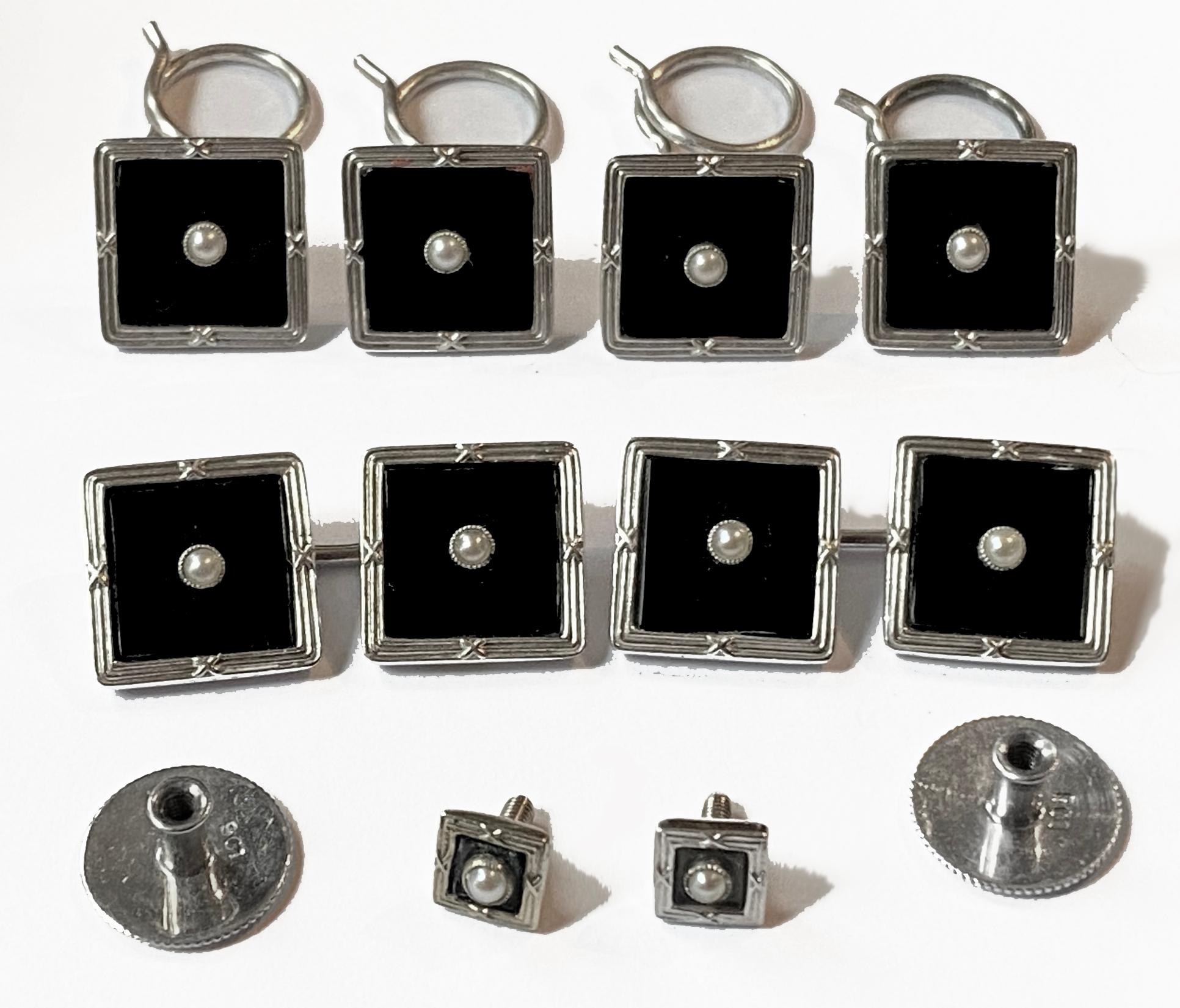 Art Deco Onyx and 9ct white gold Cufflinks Studs Tuxedo Set in fitted box, English C.1920. The studs of square shape, black onyx centre, gold surround, the centre of each with a small pearl. The Cufflinks with link between, collar studs set with
