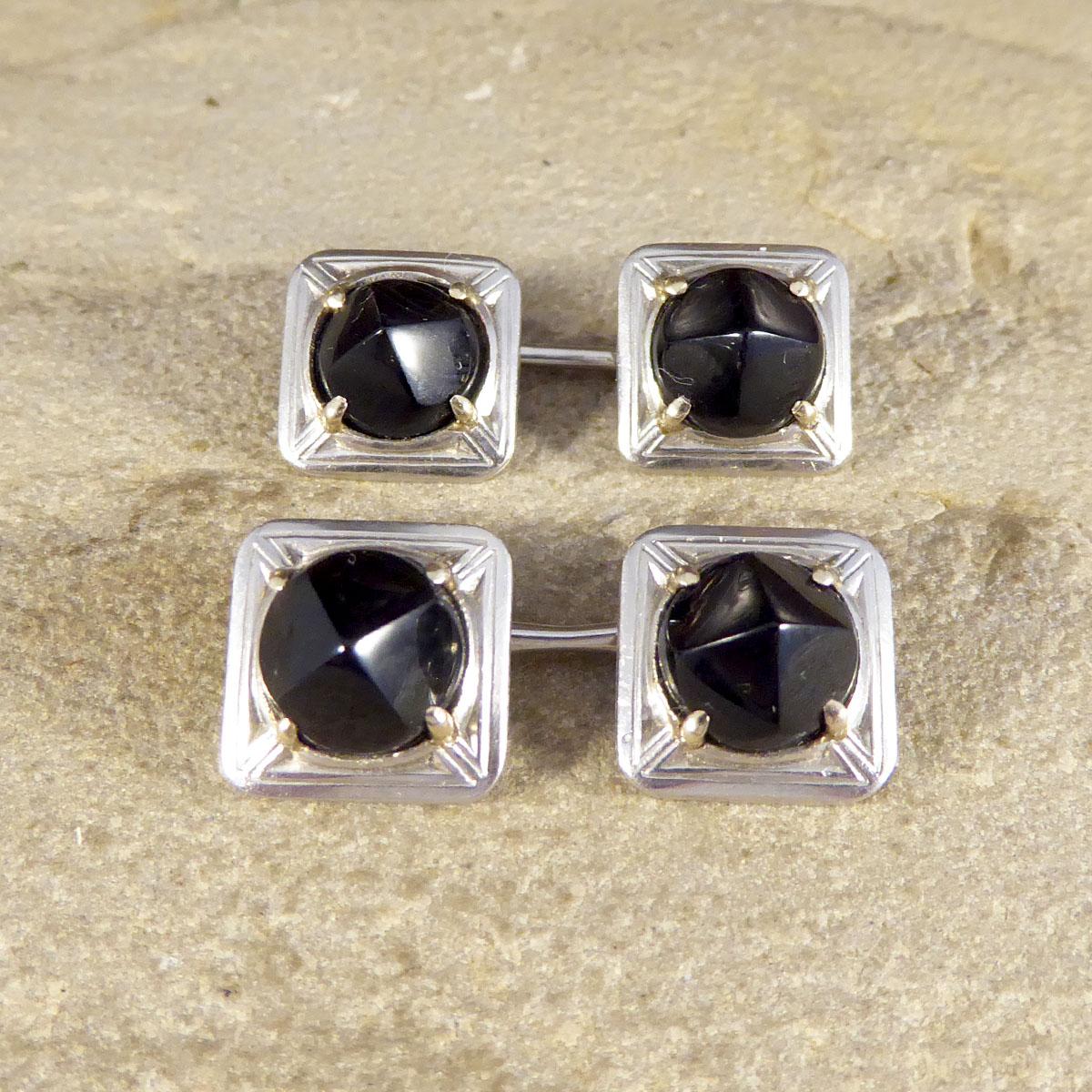 These Cufflinks have been hand crafted in the Art Deco era showing a square style and design. There are two Onyx stones reaching a curved point in each Cufflinks, set in a four claw White Gold setting. Each of the four Onyx stones are held into