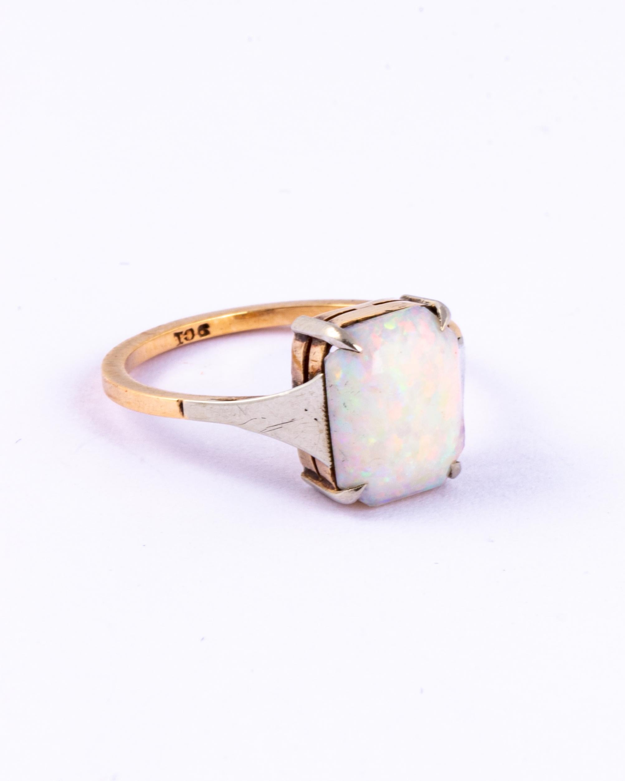 This Superb art deco opal is set in 9ct yellow & white gold. The glossy and colourful stone s set in simple claws. 

Size: M 1/2 or 6 1/4 
Stone Dimensions: 10x8mm

Weight: 1.7 grams
