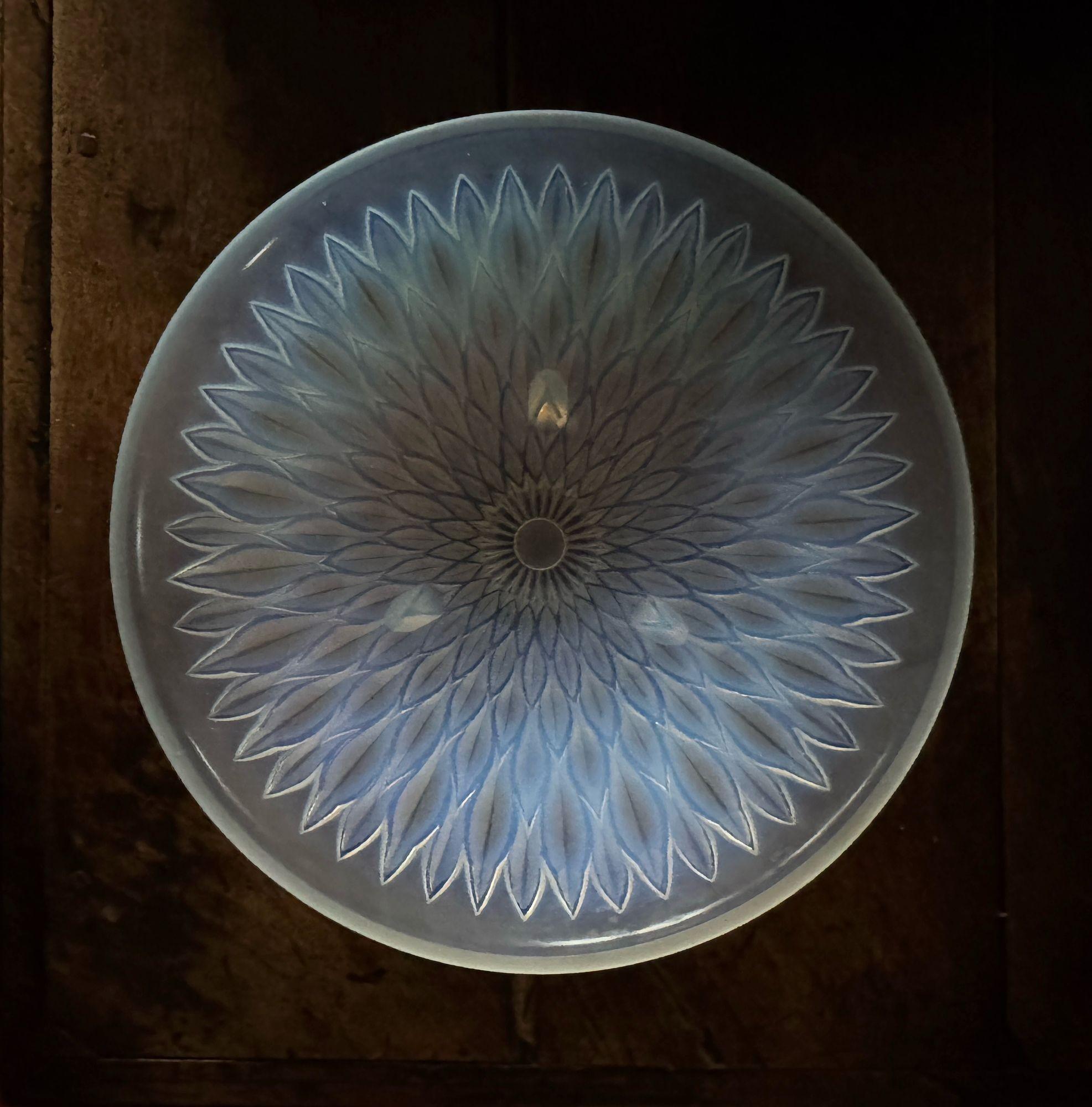 A French 20thC Opalescent moulded glass dish with geometric leaf pattern. Dimensions; H 7cm Diameter 30cm Stamped made in France this is attributed to André Hunebelle, who became a decorator, designer and then master glassmaker in the mid-1920s. His