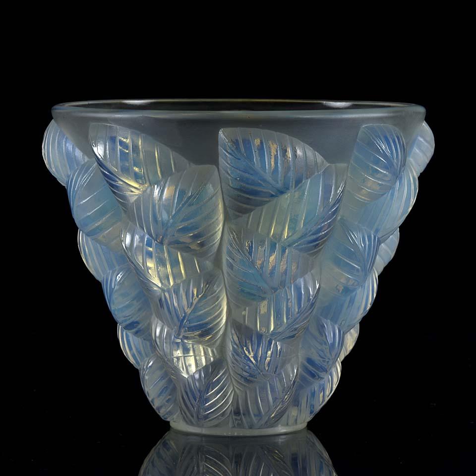 A beautiful early 20th century Art Deco opalescent glass vase decorated with a raised geometric leaf design, exhibiting very fine sky blue opalescent color and excellent hand finished surface detail, signed R Lalique France.

Moissac